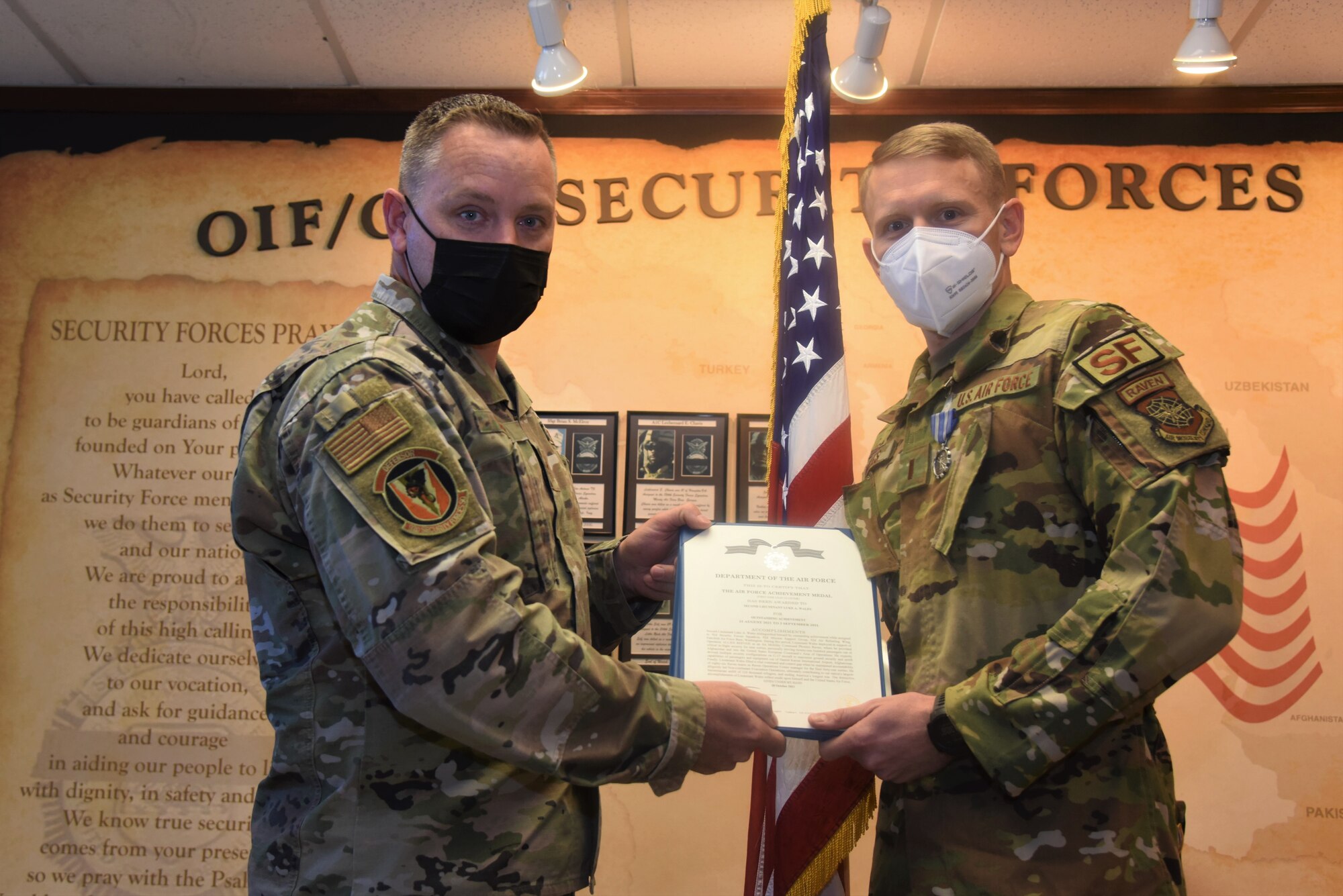 92nd Security Forces Squadron commander awards the Air Force Achievement Medal to U.S. Air Force 2nd Lt. Luke Wales, 92nd SFS Logistics officer in charge and Phoenix Raven