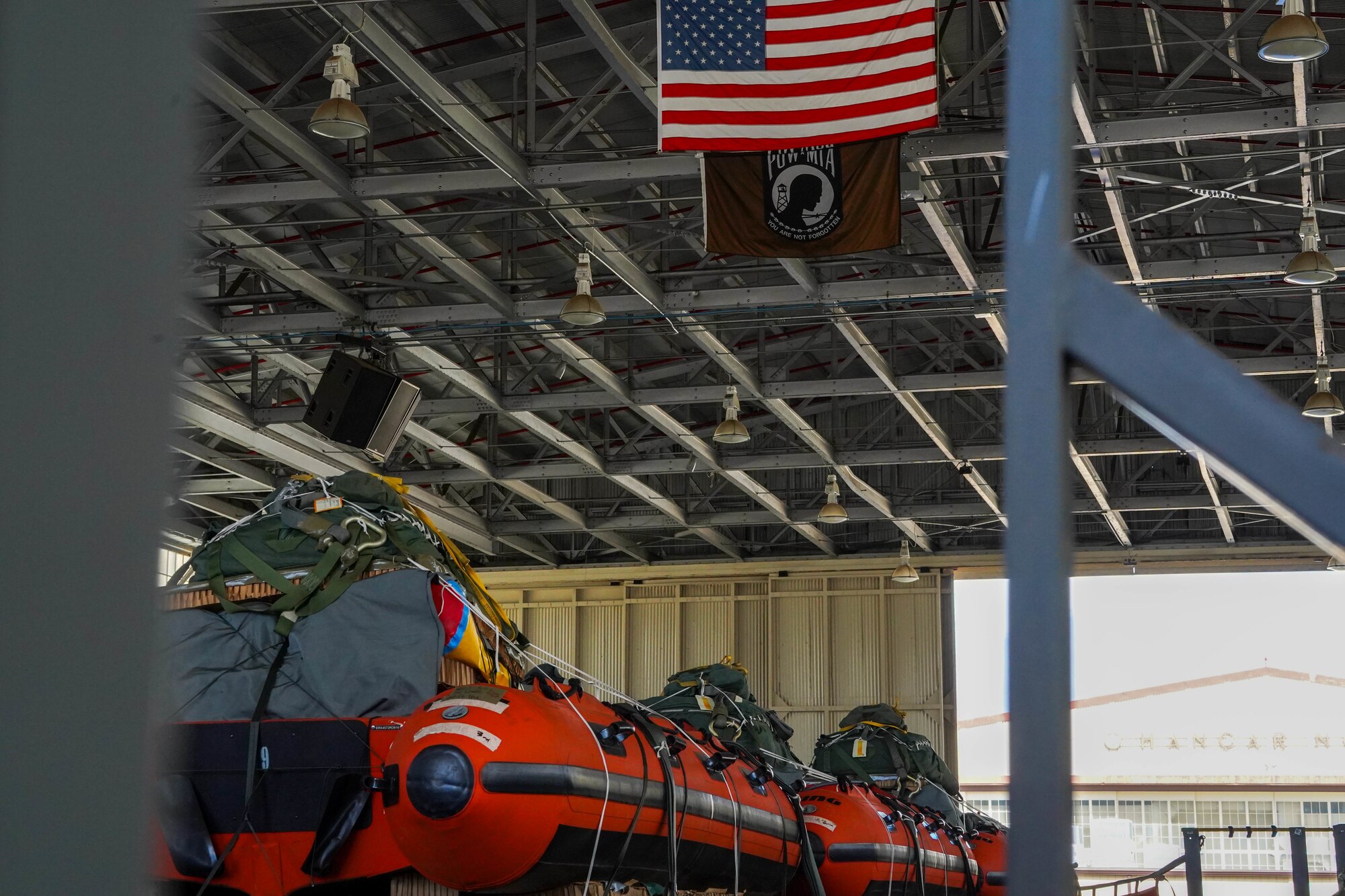 Airmen from the 647th Logistics Readiness Squadron move cargo onto loading trucks to support the NASA Human Space Flight Crew 2 and Crew 3 landing and launch if required at Joint Base Pearl-Harbor-Hickam, Hawaii, Oct. 29, 2021. The 647th LRS supported NASA by uploading life-saving equipment on a C-17 Globemaster III ensuring the aircraft and equipment was ready to assist astronauts during launch, flight and landing operations. (U.S. Air Force photo by Airman 1st Class Makensie Cooper)