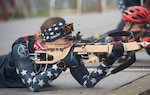 Spc. Deedra Irwin, a human resources specialist with 86th Troop Command, 86th Infantry Brigade Combat Team (Mountain), Vermont National Guard, fires a Biathlon rifle during a practice session at the Camp Ethan Allen Training Site in Jericho, Vermont, on Nov. 2, 2021. Irwin, a native of Pulaski, Wisconsin, competed in the 2021 Biathlon World Championship and is on Team USA's 2021-2022 National A Team. (U.S. Army National Guard photo by Don Branum)