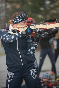 Spc. Deedra Irwin, a human resources specialist with 86th Troop Command, 86th Infantry Brigade Combat Team (Mountain), Vermont National Guard, fires a Biathlon rifle during a practice session at the Camp Ethan Allen Training Site in Jericho, Vermont, on Nov. 2, 2021. Irwin, a native of Pulaski, Wisconsin, competed in the 2021 Biathlon World Championship and is on Team USA's 2021-2022 National A Team. (U.S. Army National Guard photo by Don Branum)