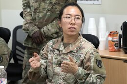 Staff Sgt. Mengqi Wang, a financial management technician assigned to the Kaiserslautern, Germany, based 266th Finance Support Center, discusses a main point in a training session on international money laundering at Camp Arifjan, Kuwait, Oct. 16, 2021. The 266th FISC was selected to pilot the introduction of counter threat finance techniques into the Army’s conventional forces. Soldiers assigned to the 266th FISC create financial profiles, perform suspicious activity report reviews, conduct commodity flow analyses and execute financial document exploitation—tasks that provide commanders with a greater understanding of the financial underpinnings of adversarial groups.