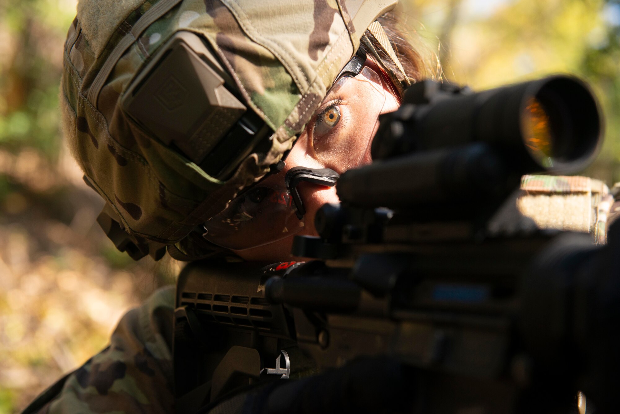 Tech. Sgt. Julia Matthews, 934th Aeromedical Staging Squadron, engages multiple targets with her M4 carbine during a shoot, move and communicate exercise on Oct. 15, 2021 at the Minneapolis-St. Paul Air Reserve Station, Minn. Airmen were placed in two-person teams with 934th Security Forces Squadron Defenders coaching them on how to effectively operate in an austere environment. (U.S. Air Force photo by Chris Farley)