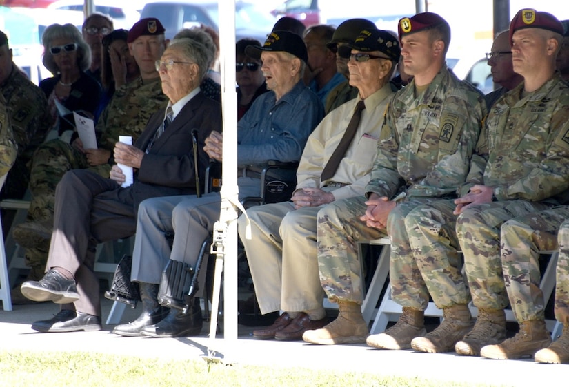 World War II veterans and soldiers gather for a D-Day anniversary.
