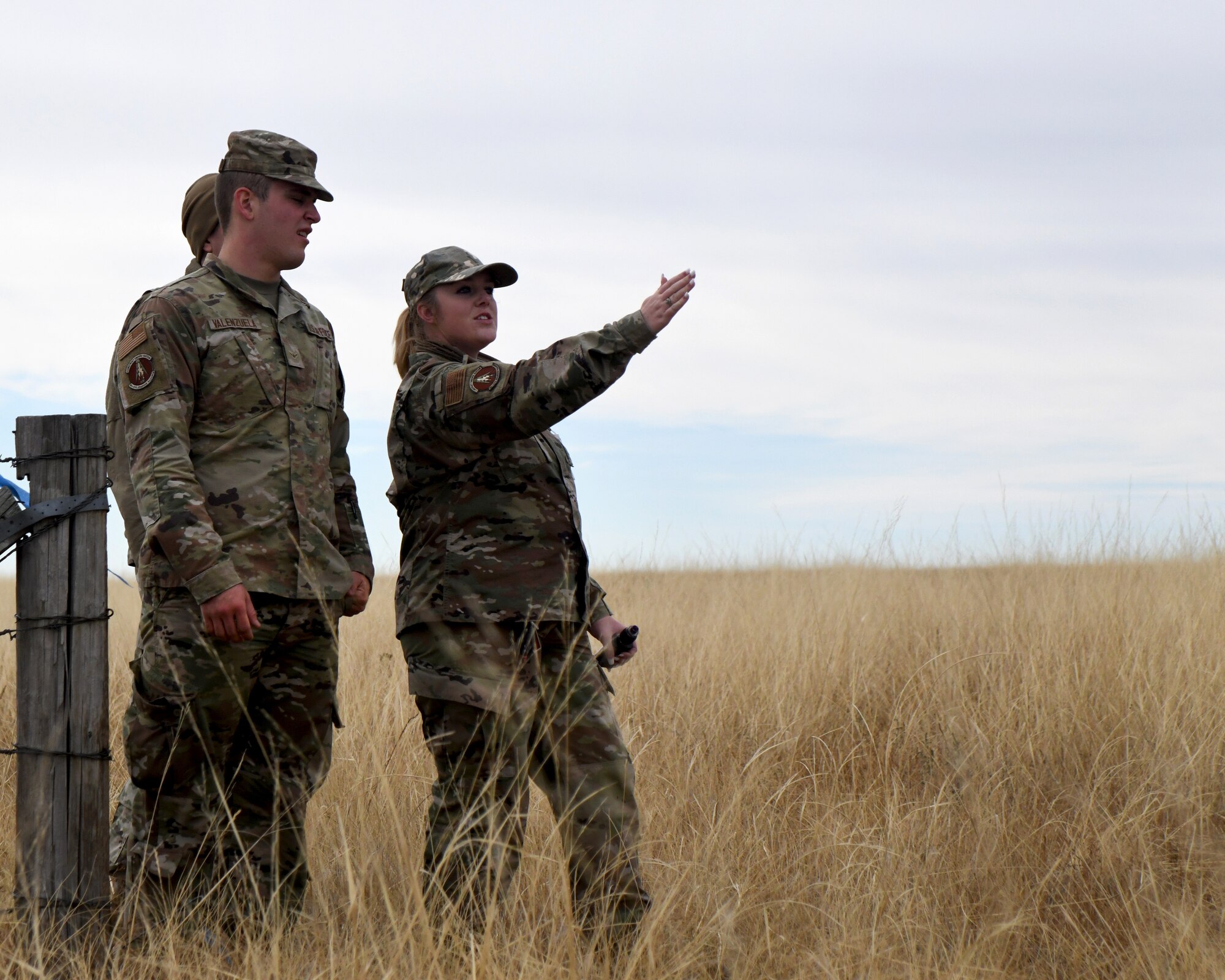 members of the 50th CES walk around practicing land navigation
