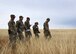 members of the 50th CES walk around practicing land navigation