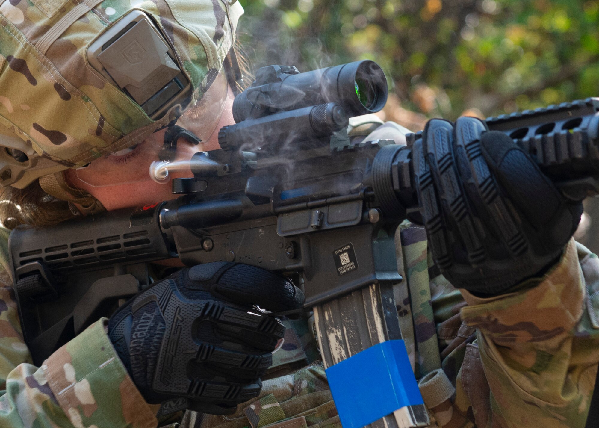 Tech. Sgt. Julia Matthews, 934th Aeromedical Staging Squadron, engages multiple targets with her M4 carbine during a shoot, move and communicate exercise on Oct. 15, 2021 at the Minneapolis-St. Paul Air Reserve Station, Minn. Airmen were placed in two-person teams with 934th Security Forces Squadron Defenders coaching them through failure drills and on how to effectively operate in an austere environment. (U.S. Air Force photo by Chris Farley)