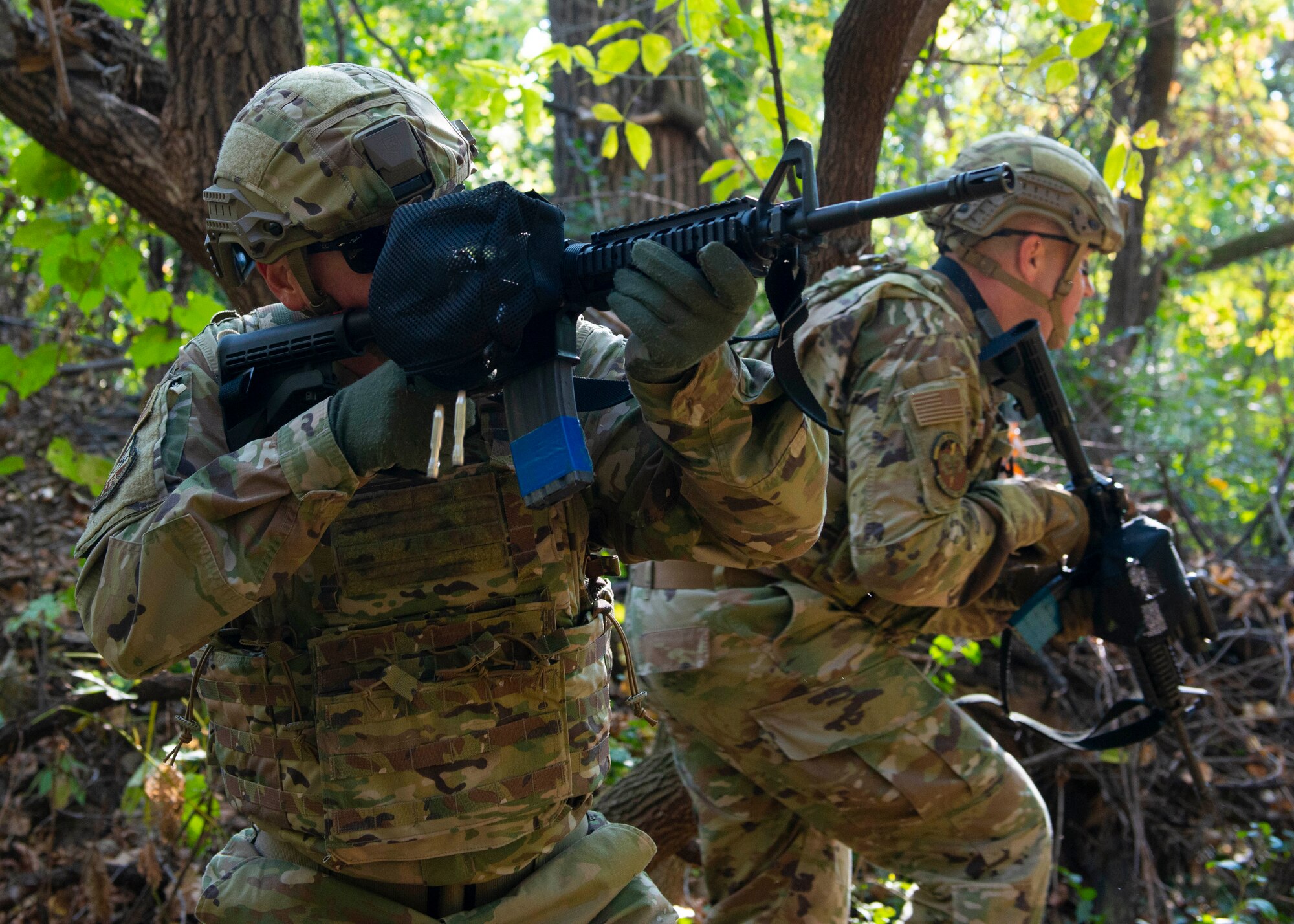 Capt. Burl Holland, 934th Airlift Wing Yellow Ribbon representative, provides suppressive fire with his M4 carbine as Lt. Col. Charles Trovarello, 934th Security Forces Squadron, advances forward to engage a target during a shoot, move and communicate exercise on Oct. 15, 2021 at the Minneapolis-St. Paul Air Reserve Station, Minn. Airmen were placed in two-person teams with 934th Security Forces Squadron Defenders coaching them through failure drills and on how to effectively operate in an austere environment. (U.S. Air Force photo by Chris Farley)