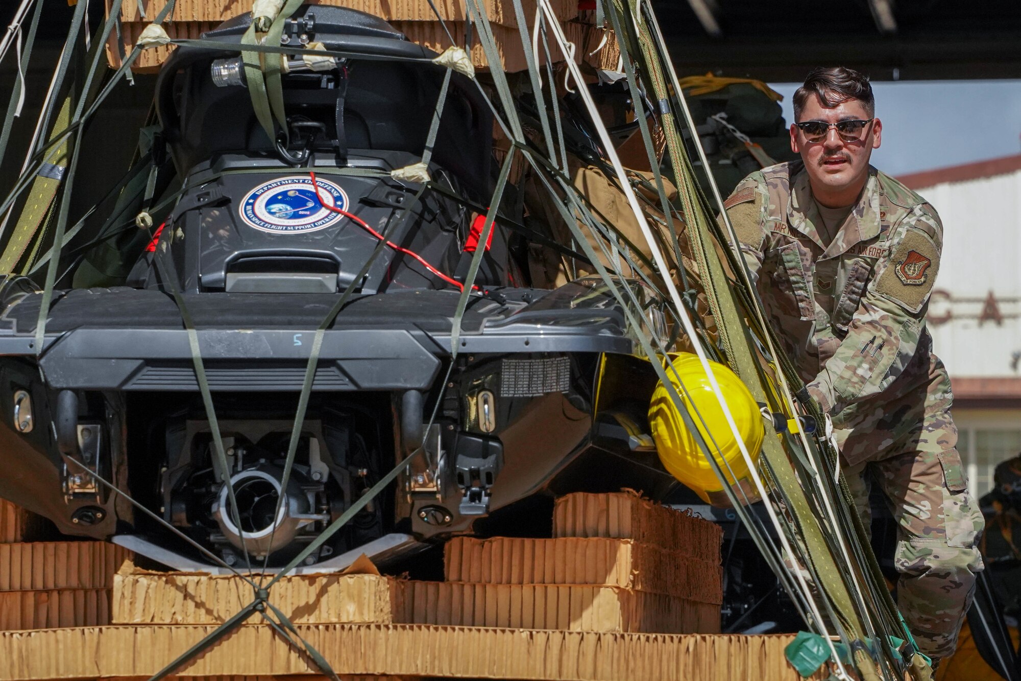 Staff Sgt. Jonathan Martinez, 647th Logistics Readiness Squadron combat mobility flight supervisor, loads a jetski onto a K-loader trailer to support the NASA Human Space Flight Crew 2 return and Space Flight Crew 3 if required at Joint Base Pearl Harbor-Hickam, Hawaii, Oct. 29, 2021. The 647th LRS uploaded life-saving rescue equipment to ensure it is ready at a moment’s notice to safeguard astronauts taking off and returning to Earth from the International Space Station. (U.S. Air Force photo by Airman 1st Class Makensie Cooper)