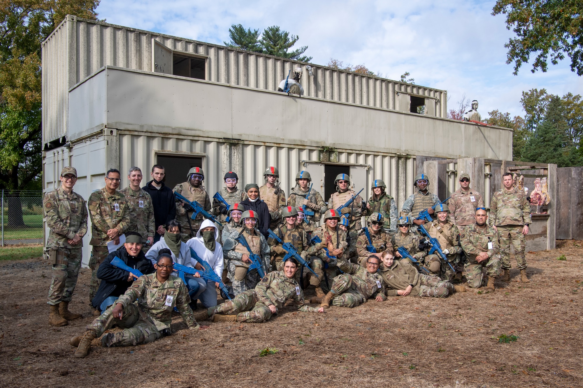 U.S. Airmen from the 514th Air Mobility Wing and the 421st Combat Training Squadron, both at Joint Base McGuire-Dix-Lakehurst, New Jersey, the 171st Air Refueling Wing, Pennsylvania, and the Office of the Surgeon General, Headquarters U.S. Air Force, Virginia, pose for a photo at the Medical Simulation and Training Center at JB MDL, N.J., October 31, 2021. The Airmen participated in a pilot program Tactical Combat Casualty Care course designed to provide members who are not normally involved in combat environments the skills to survive and care for casualties in the event they are under attack.