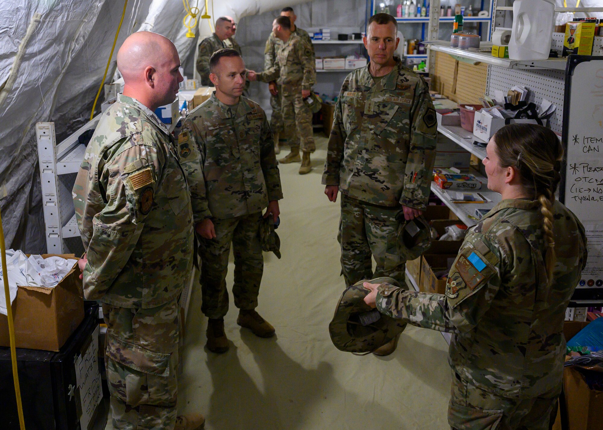 U.S. Air Force Capt. Darby Germain, 378th Air Expeditionary Wing Sexual Assault Response Coordinator, shares information about the new U.S. Serve-Us Members Attic and other recent innovative projects with U.S. Air Force Lt. Gen. Greg Guillot, 9th Air Force (Air Forces Central) commander, and U.S. Air Force Chief Master Sgt. John Storms, 9th AF (AFCENT) command chief, during his visit to Prince Sultan Air Base, Kingdom of Saudi Arabia, Oct. 31, 2021. Guillot and Storms visited several units across PSAB, meeting with various personnel to learn about recent innovation, diversity and expansion efforts on base. (U.S. Air Force photo by Senior Airman Samuel Earick)