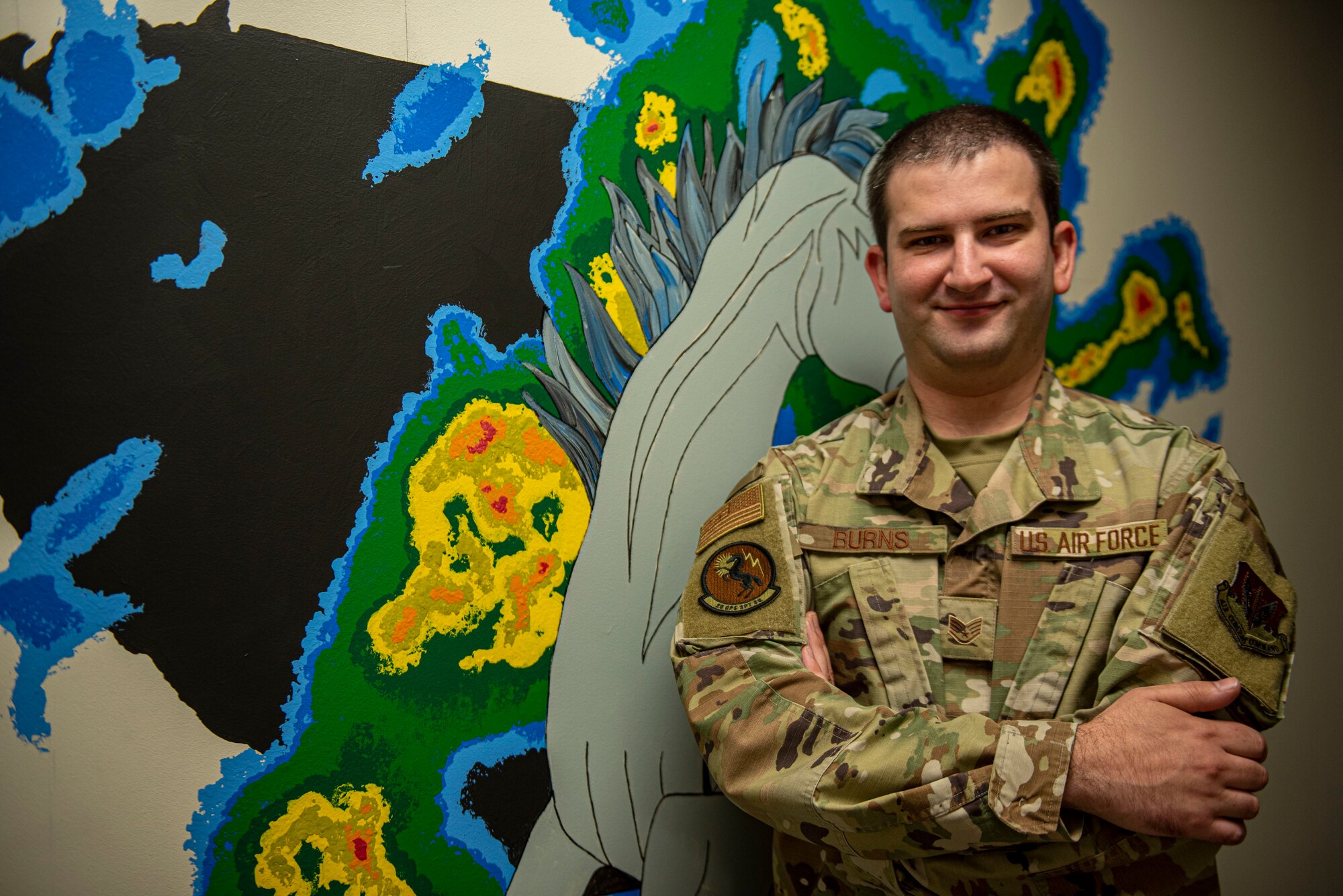 An Airman stands for a portrait.