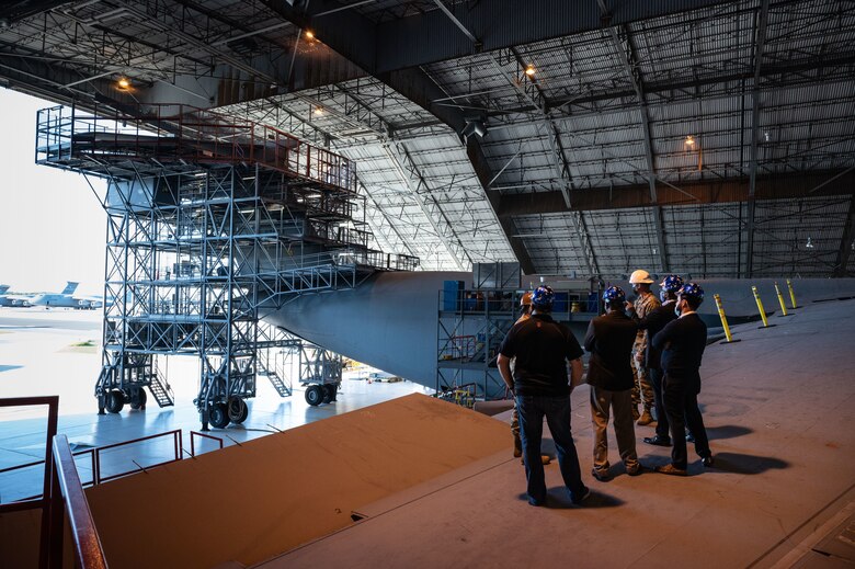 Team Dover Airmen and the T-Mobile customer discovery team tour the Isochronal Maintenance Dock on Dover Air Force Base, Delaware, Oct. 20, 2021. The T-Mobile team met with Dover AFB Airmen to discuss new innovative ways to enhance mission effectiveness and accelerate change in meaningful ways. (U.S. Air Force photo by Senior Airman Marco A. Gomez)