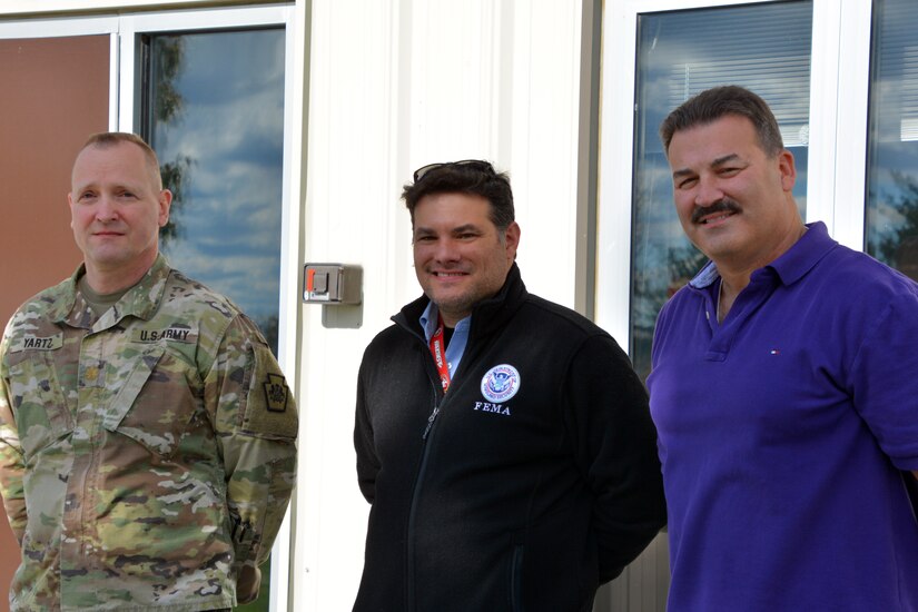 Attendees at the FEMA Region 3-facilitated Fall Regional Emergency Communications Coordination Working Group at Fort Indiantown Gap, Pennsylvania, on Nov. 3 and 4 included: (left to right) Maj. Victor Yartz, Pennsylvania National Guard,  Jorge Vidal, chair of the group and regional emergency communication coordinator for FEMA Region 3.and Charlie Guddemi, co-chair of the working group and the D.C. Statewide Interoperability Coordinator (SWIC) an emergency manager at the District of Columbia’s Homeland Security and Emergency Management Agency (HSEMA). More than 60 emergency management communicators gathered for the event to share best practices.