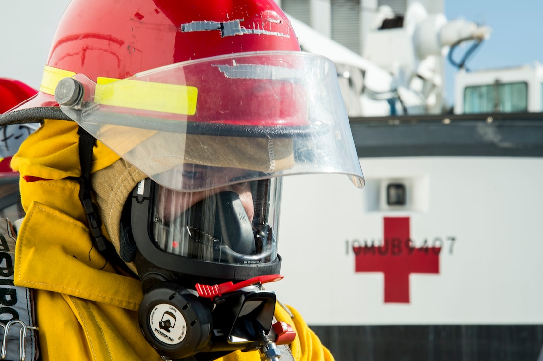 A civilian mariner assigned to Military Sealift Command (MSC) hospital ship USNS Mercy (T-AH 19) participates in a fire drill Nov. 3, 2021.