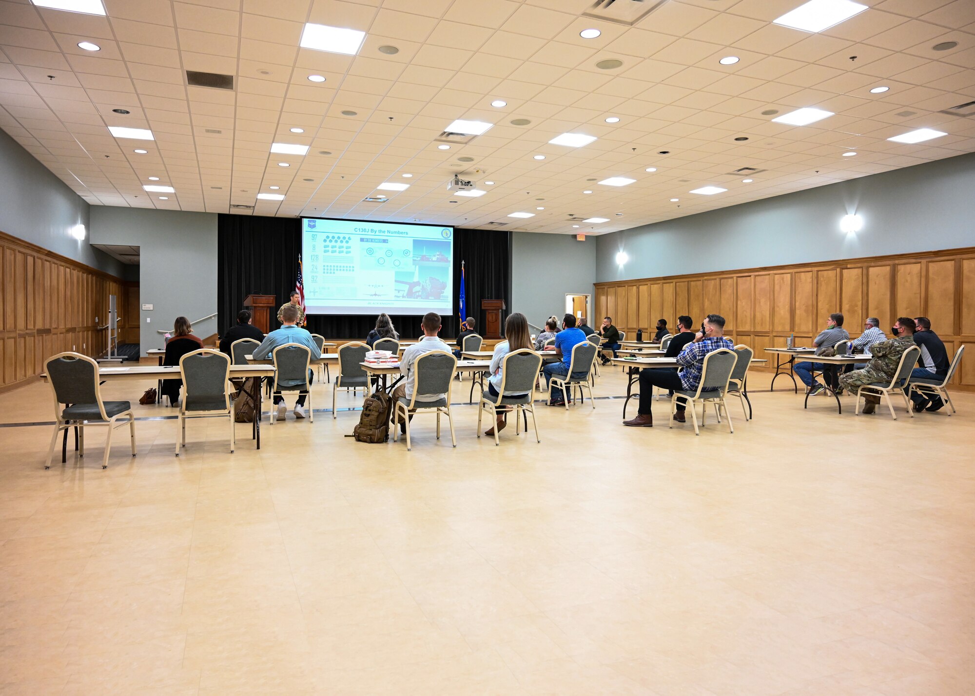 A group of people listen to a presentation