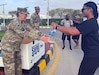 Soldiers and civilians from Area Support Group-Jordan participate in a "Lighten Your Load" ruck march October 29.