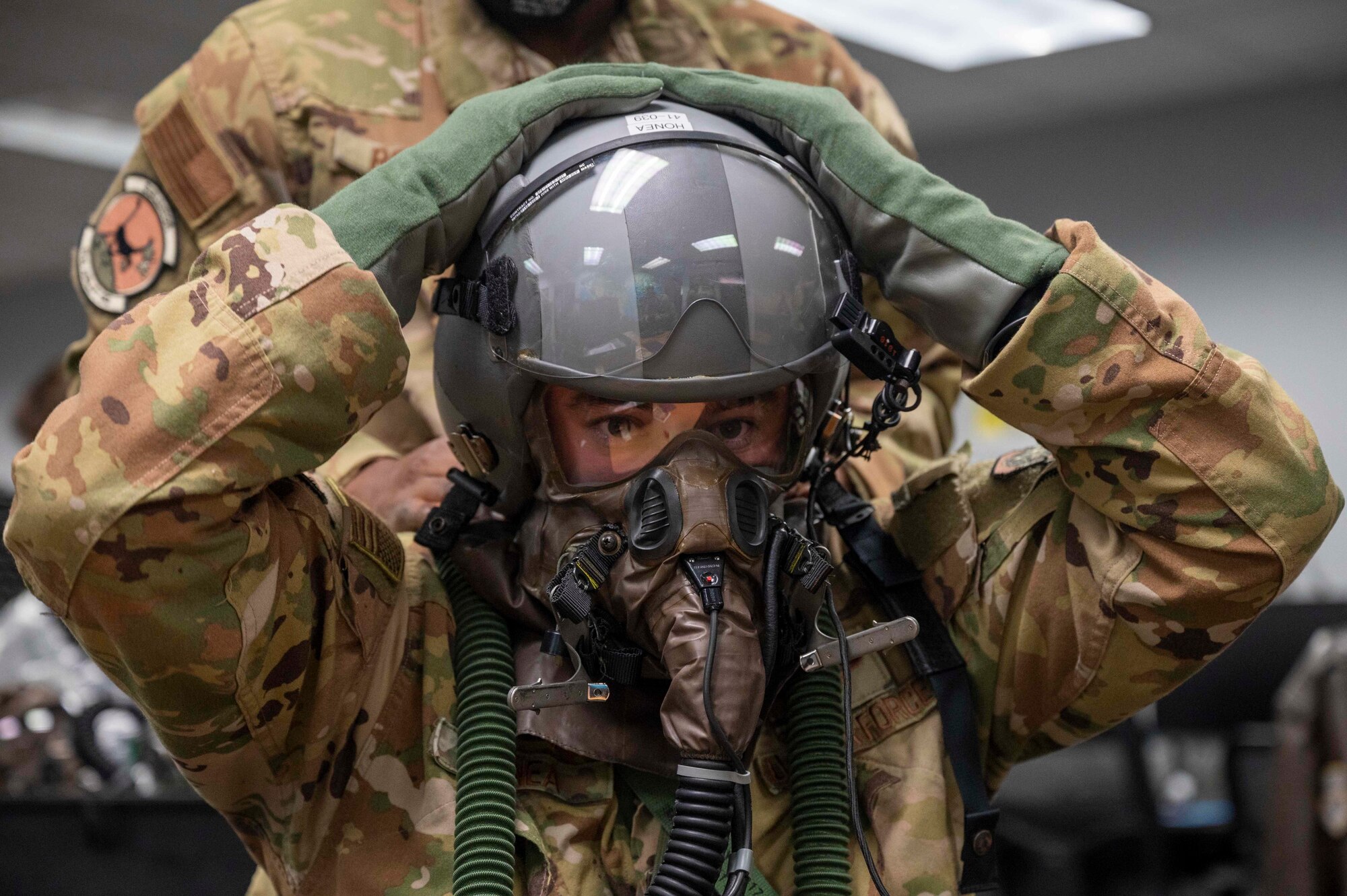 Loadmasters don AERPS gear before flight.