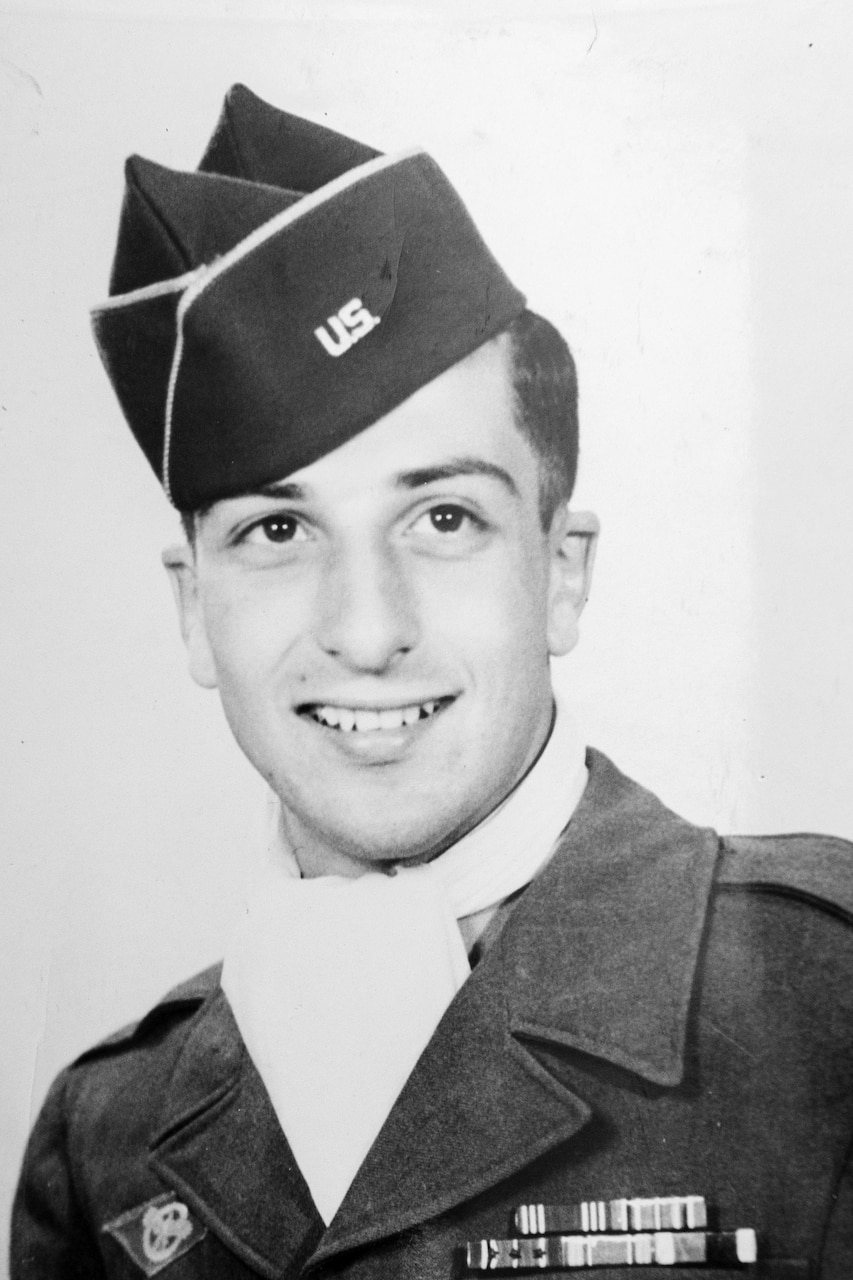 A soldier poses for a photo.