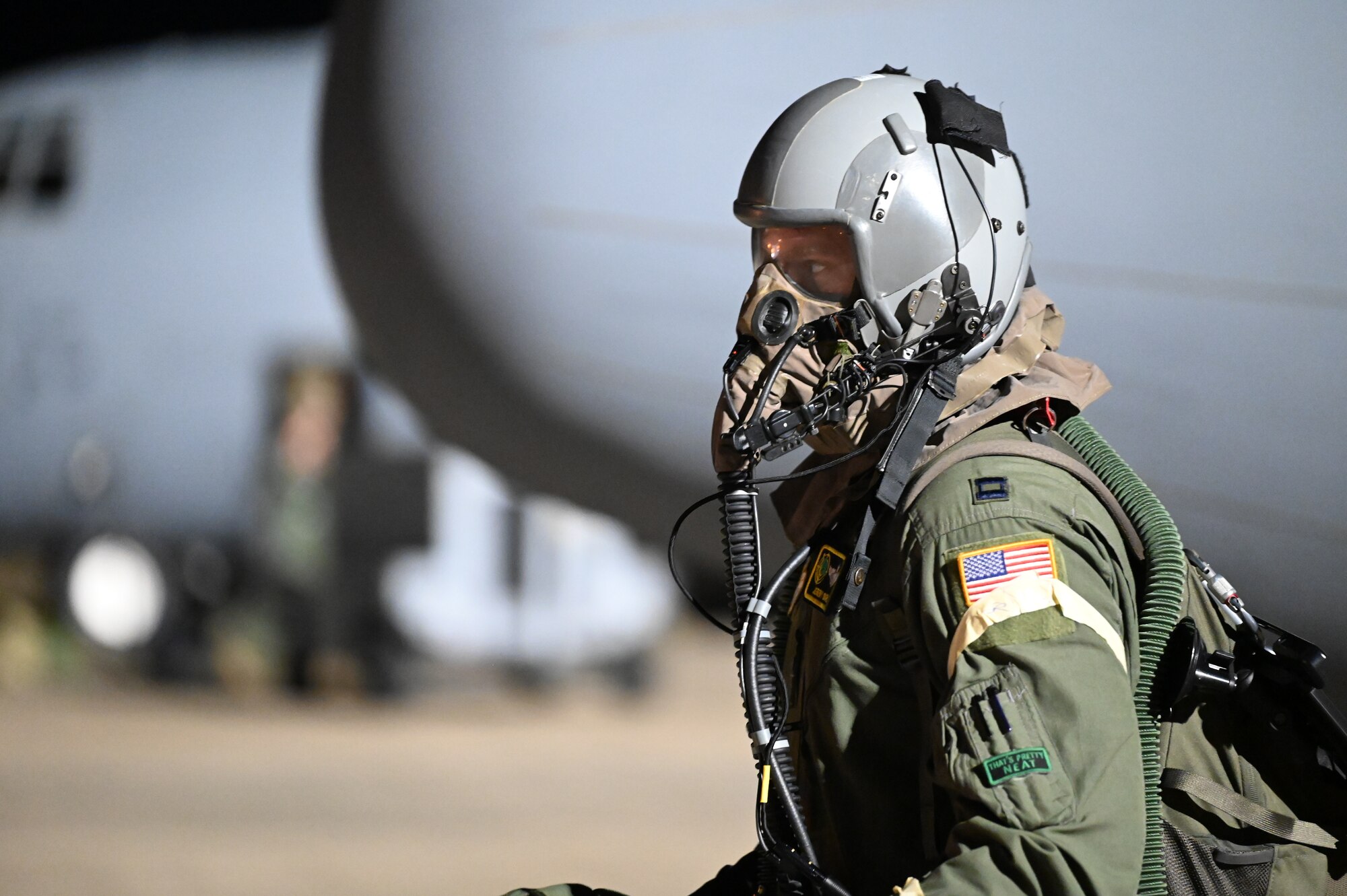 A pilot from the 34th CTS walks to a C-130J in AERPS gear.