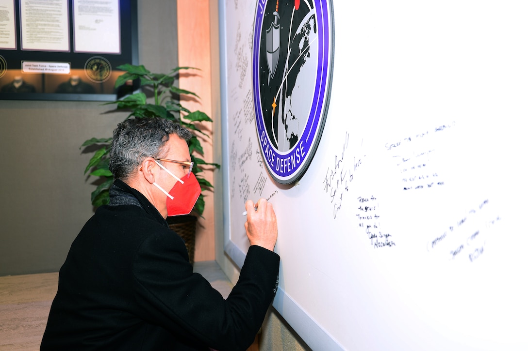 Colin H. Kahl, the Department of Defense's Under Secretary of Defense for Policy, signs the visitors board during a visit to the National Space Defense Center on Nov. 2, 2021, at Schriever Space Force Base, Colorado.