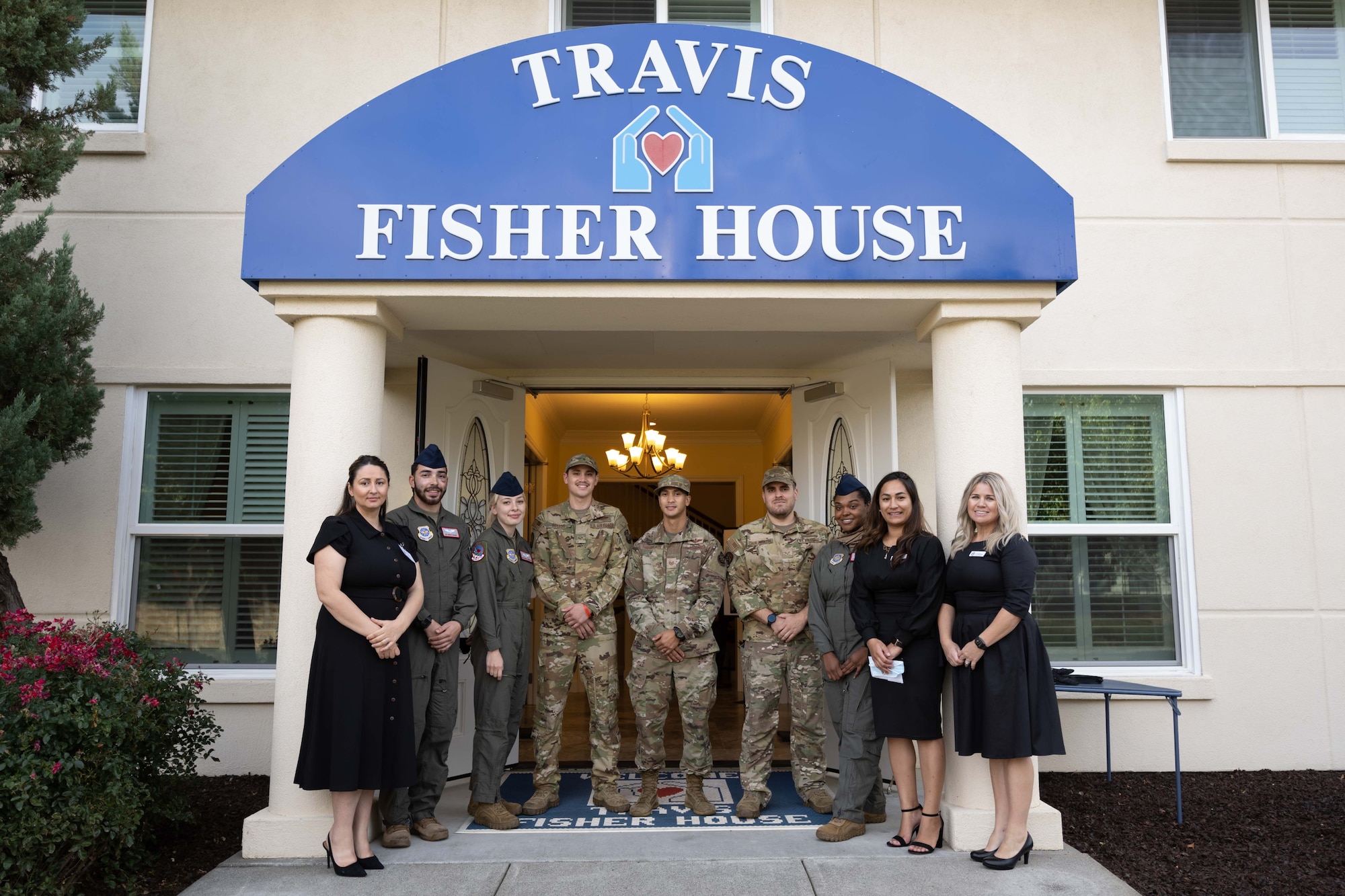 Airmen help Fisher House staff during grand re-opening