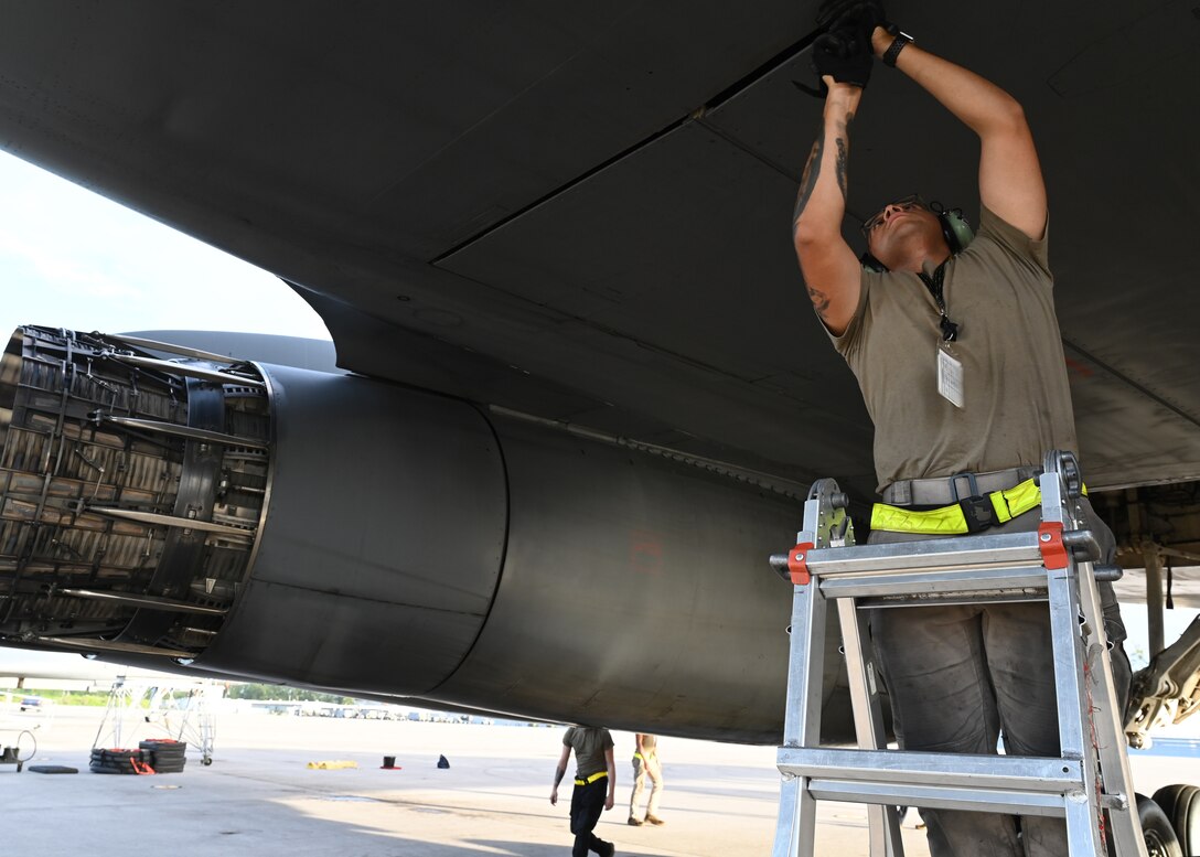 Photo of an Airman performing maintenance on an aircraft