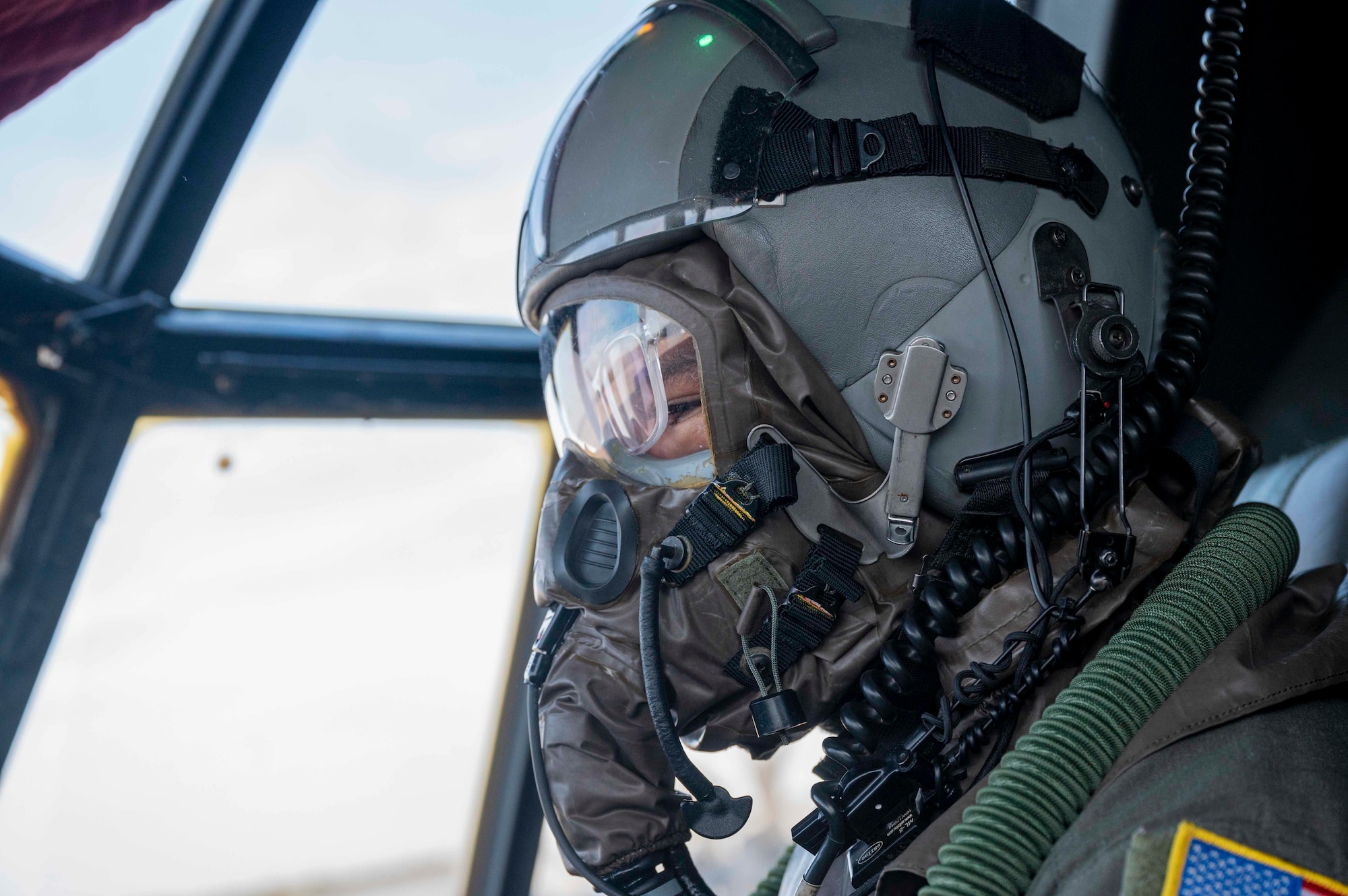 A loadmaster prepares a C-130J for flight.