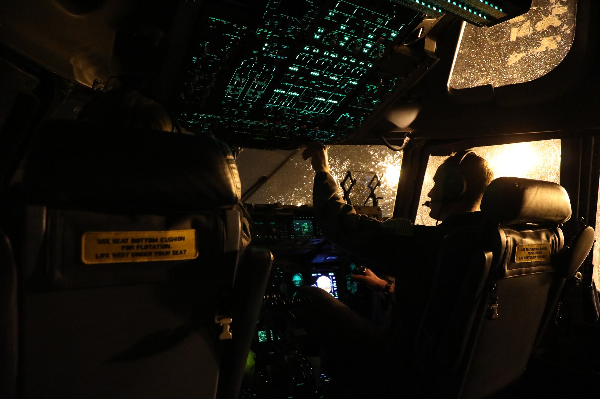 U.S. Air Force Capt. Dale Becker, 7th Airlift Squadron pilot, prepares a C-17 Globemaster III for takeoff during Exercise Rainier War 21B at Joint Base Lewis-McChord, Washington, Nov. 3, 2021. Rainier War 21B exercises and evaluates the wing’s ability to employ the force and their ability to perform during wartime and/or contingency taskings in a high-intensity, wartime contested, degraded and operationally limited environment while supporting the contingency operations against a near-peer adversary in the U.S. Indo-Pacific Command area of responsibility. (U.S. Air Force photo by Senior Airman Christopher Sommers)