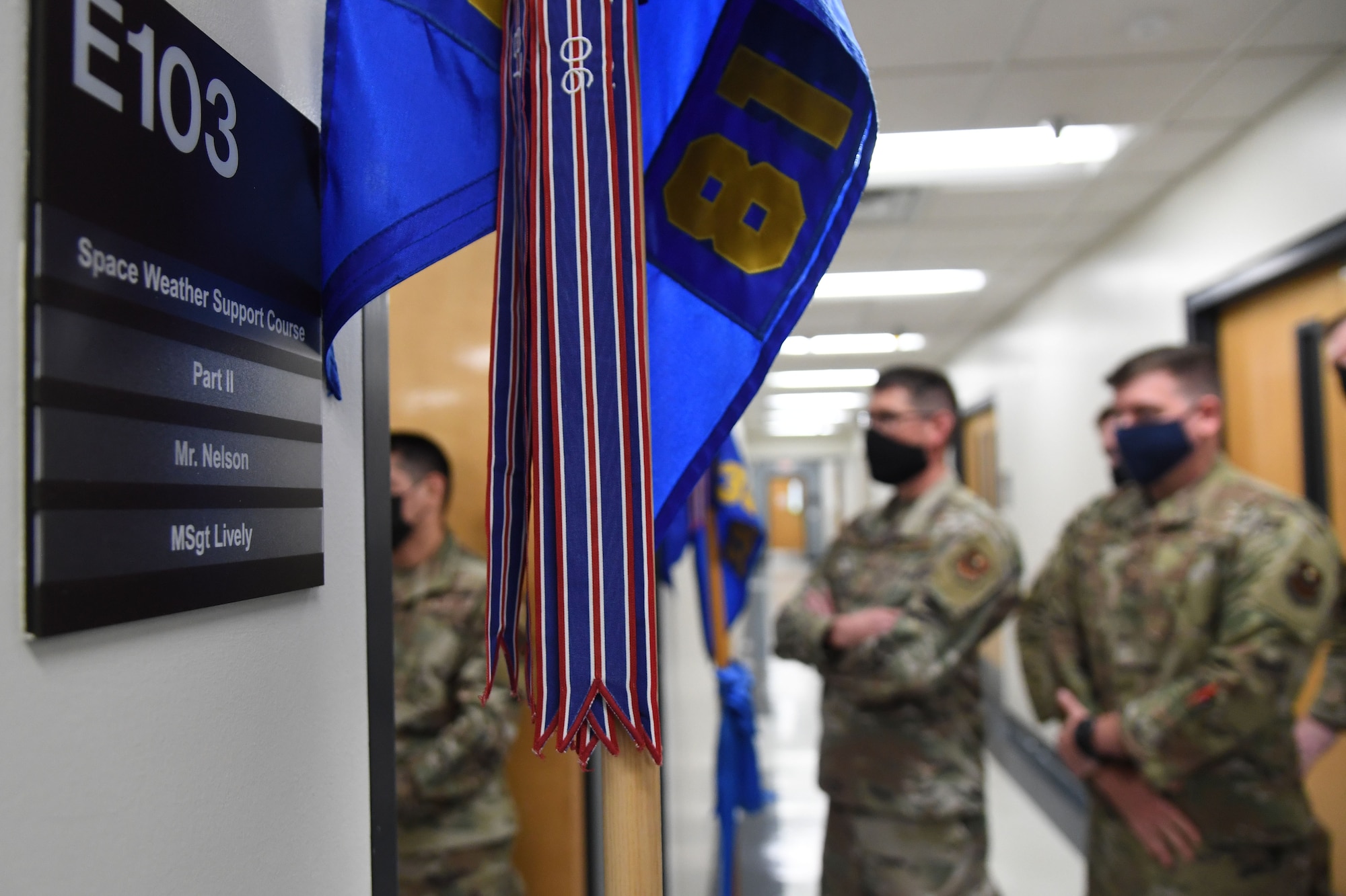 A classroom plaque is displayed during the Space Weather Support Course ribbon cutting ceremony inside the Weather Training Complex at Keesler Air Force Base, Mississippi, Nov. 3, 2021. The course will apply knowledge of the effects of the natural environment on space systems and also space weather effects on terrestrial systems in support of multi-domain operations. (U.S. Air Force photo by Kemberly Groue)