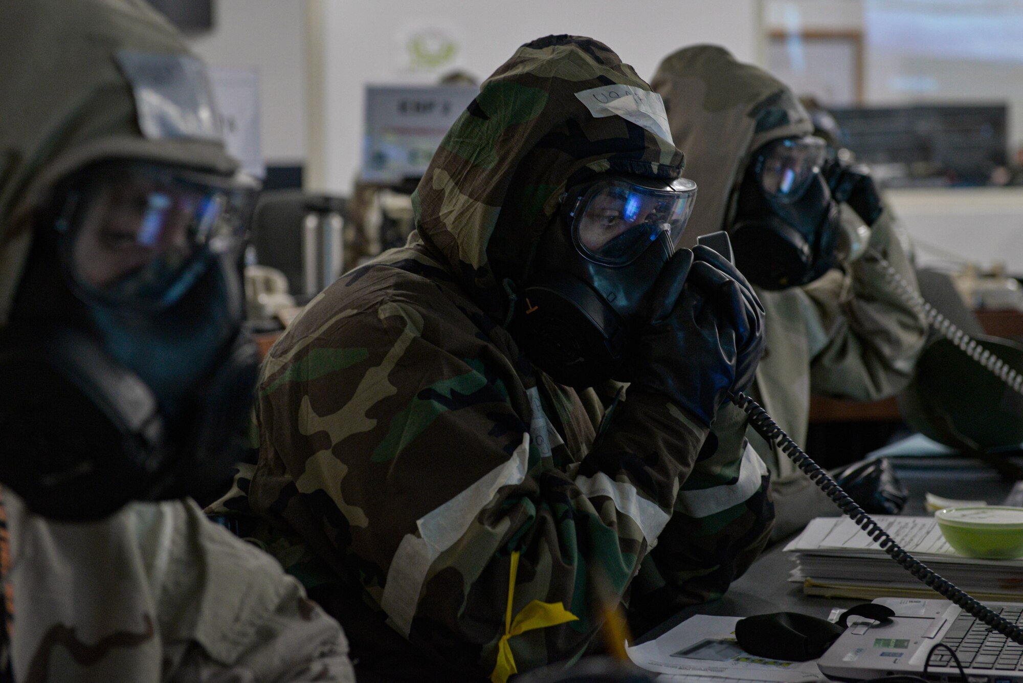 U.S. Air Force Airmen working in the Emergency Operations Center call their Unit Control Centers as part of exercise Gunslinger 21-06 on Mountain Home Air Force Base, Idaho, Oct. 26, 2021. The Phase II exercise demonstrates the wing’s ability to survive and operate in a chemically contested environment.
