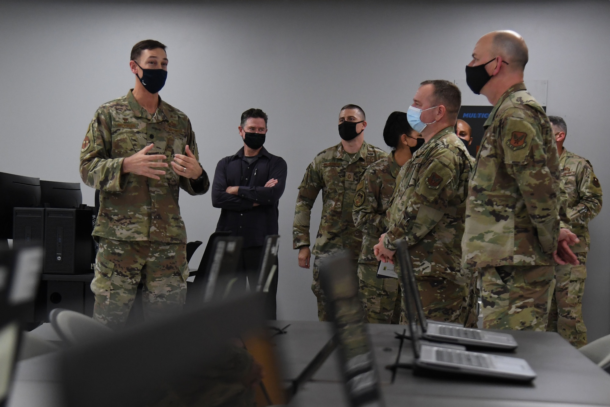 U.S. Air Force Lt. Col. Kevin Brockler, 335th Training Squadron commander, provides a tour inside a classroom during the Space Weather Support Course ribbon cutting ceremony inside the Weather Training Complex at Keesler Air Force Base, Mississippi, Nov. 3, 2021. The course will apply knowledge of the effects of the natural environment on space systems and also space weather effects on terrestrial systems in support of multi-domain operations. (U.S. Air Force photo by Kemberly Groue)