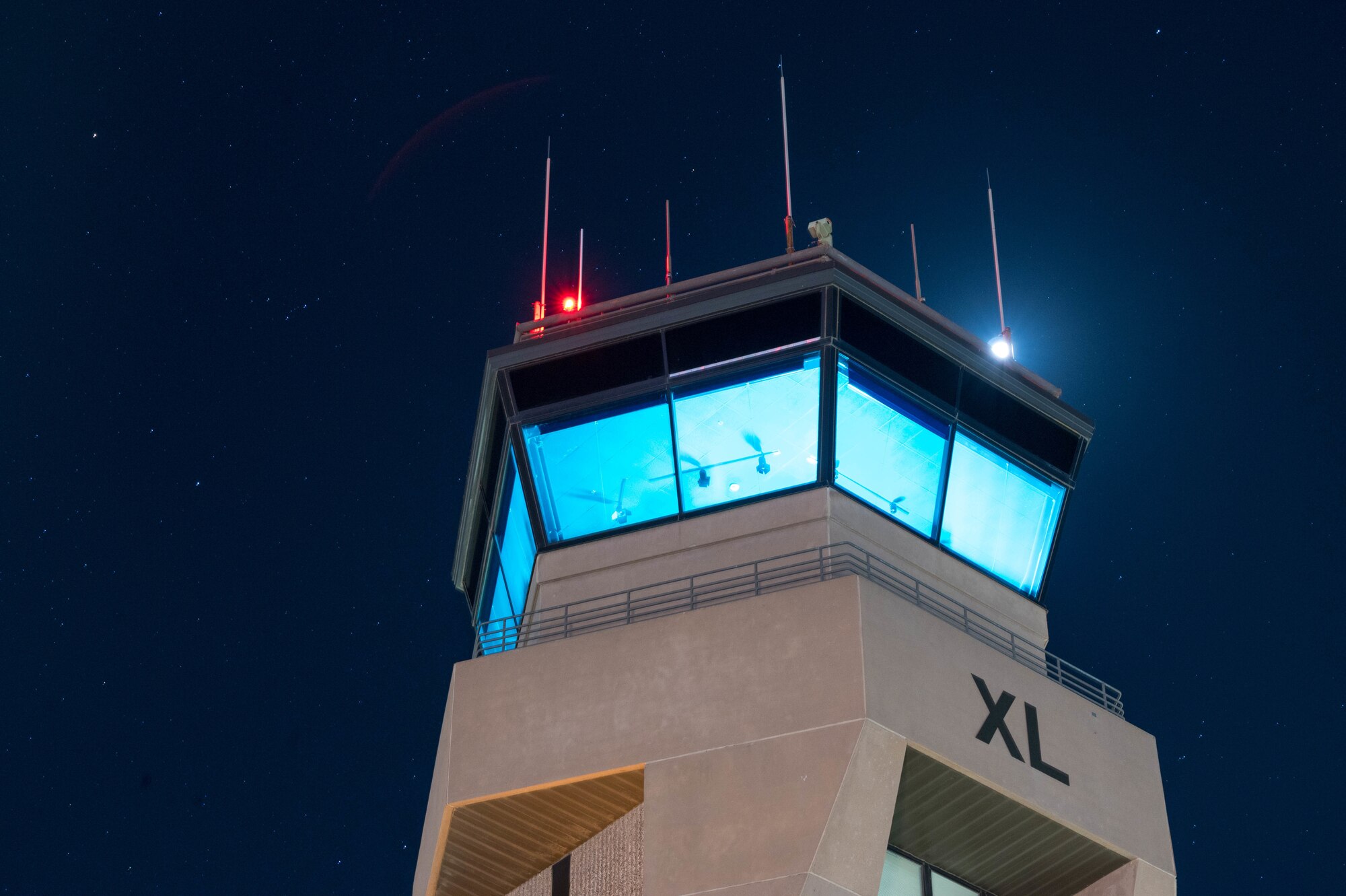Ultra-violet lights decontaminate the air traffic control tower to mitigate the spread of COVID-19 after night operations February 20, 2021 at Laughlin Air Force Base. The 47th Operations Support Squadron supported a late-night delivery of relief supplies from the Texas Air National Guard in the wake of Winter Storm Uri. (U.S. Air Force photo by Master Sgt. Joseph Carpenter)