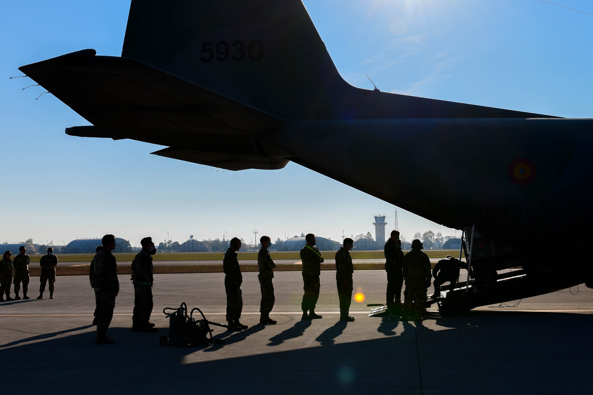 Romanian air force airmen and U.S. Air Force Airmen assigned to the 31st Logistics Readiness Squadron load a Romanian air force C-130 with critical cargo in support of operation Castle Forge at Aviano Air Base, Italy, Oct. 29, 2021. Since the start of operation Castle Forge in Larissa Air Base, Greece on Oct. 6, the 31st Fighter Wing has supported F-15E Strike Eagles from the 336th Fighter Squadron, 4th Fighter Wing, Seymour Johnson Air Force Base, N.C. Castle Forge is a larger U.S. Air Forces Europe-Air Forces Africa-led joint, multinational training event and major air operation in the Black Sea region that demonstrates Agile Combat Employment. (U.S. Air Force photo by Senior Airman Brooke Moeder)