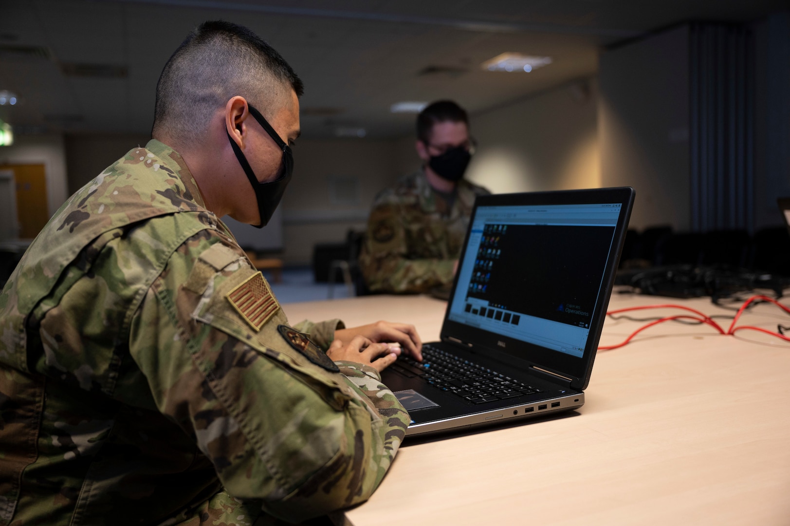 A defensive cyber network operator assigned to the 800th Cyber Protection Team, Joint Force Headquarters Cyber-Air Force, configures a cyber weapons system at RAF Fairford, United Kingdom, Oct. 8, 2021. Throughout the duration of their deployment, 800th CPT  will hunt, harden and protect networks to increase resiliency of strategic assets. They configured a weapons system to collect logs and traffic across B-1B Lancer aircraft systems in support of the 9th Expeditionary Bomb Squadron during a Bomber Task Force Europe deployment. (U.S. Air Force photo by Senior Airman Colin Hollowell)
