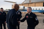 Air Force Chief of Staff Gen. CQ Brown, Jr., presents his coin to U.S. Air Force Master Sgt. Justin Burke, a 99th Airlift Squadron communications system operator, at the conclusion of an aircraft delivery ceremony at Joint Base Andrews, Md. Nov. 3, 2021. Burke and an aircrew of 99th Airlift Squadron airmen assisted Brown with flying a new C-37B Gulfstream 550 aircraft, tail #1941, that was dedicated to the founding of the Tuskegee Airmen. (U.S. Air Force photo by Tech. Sgt. Kentavist P. Brackin)
