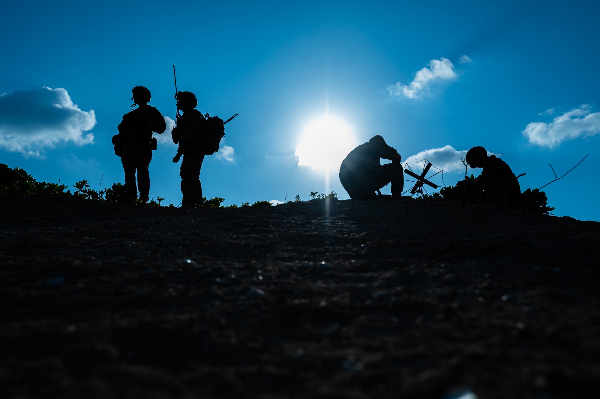 Combat controllers and Marines communicate with aircraft.