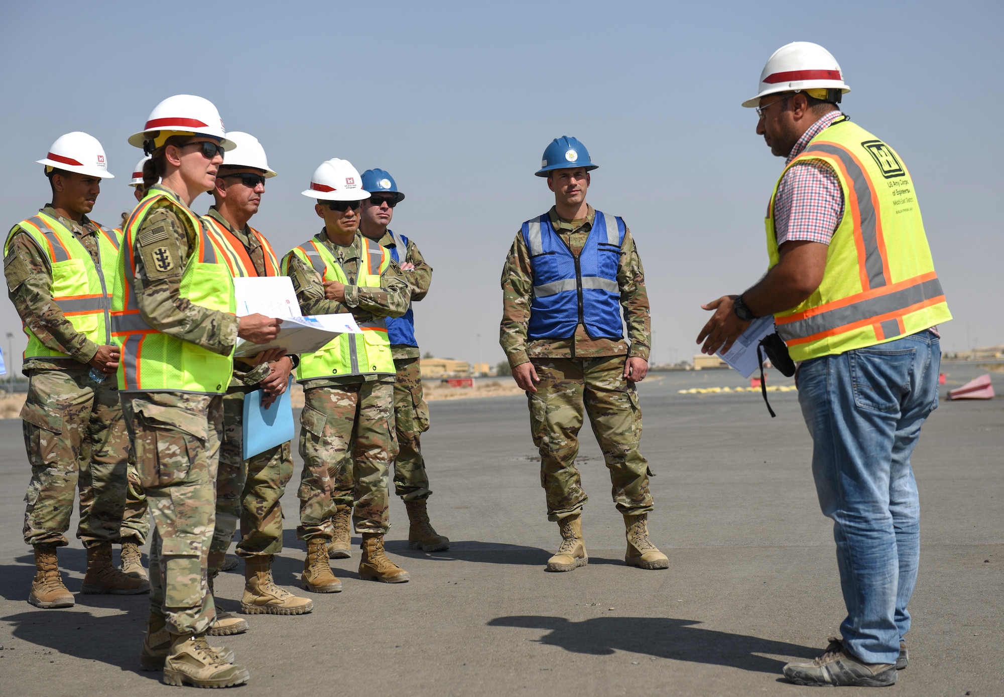 U.S. Army Maj. Gen. Kimberly Colloton, commanding general of the U.S. Army Corps of Engineers Transatlantic Division, speaks with Ali Al Salem Air Base leadership and USACE regarding the runway addition at ASAB, Kuwait, Oct. 21, 2021. The 386th Air Expeditionary Wing constantly improves its combat capabilities and readiness. (U.S. Air Force photo by Staff Sgt. Ryan Brooks)