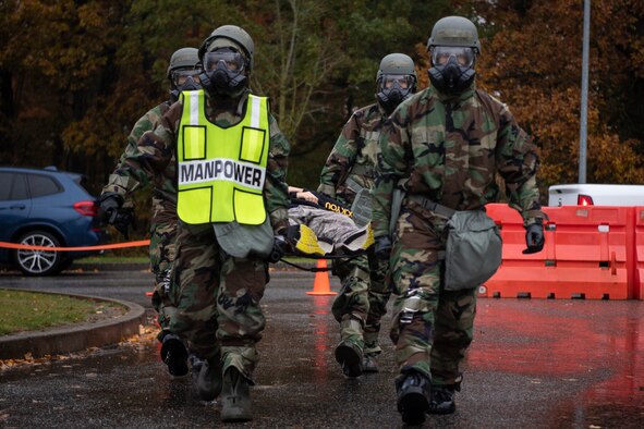 U.S. Air Force Staff Sgt. Nelson Pacheco, 52nd Medical Group public health technician, applies moulage to a simulated wounded victim’s face during exercise Sabre Storm, Nov. 3, 2021, on Spangdahlem Air Base, Germany. The moulage simulated injuries, enabling the 52nd MDG to put their readiness to the test. (U.S. Air Force photo by Staff Sgt. Melody W. Howley)