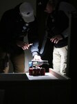 Washington National Guard Staff Sgt. Justin Belz and Sgt. Walter Fleming, survey team members with the 10th Civil Support Team, analyze a substance during a multi-agency hazardous material exercise in Discovery Park, Seattle, Wash., Nov. 3, 2021.