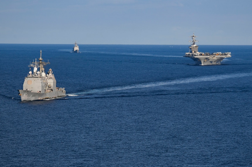 USS Shiloh (CG 67), front, USS Carl Vinson (CVN 70) and USS Lake Champlain (CG 57) transit the South China Sea.