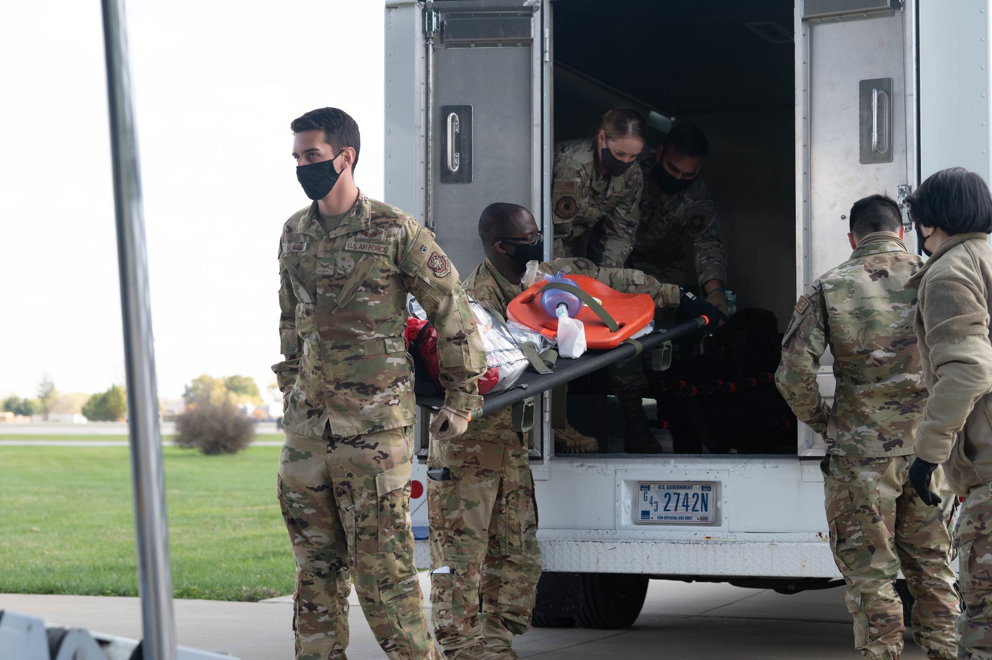 Airmen from the 375th Aeromedical Evacuation Squadron unload medical equipment during an exercise on Scott Air Force Base, Illinois, Nov. 3, 2021. Aeromedical evacuation is designed to take members from a deployed location to the next higher echelon of care. (U.S. Air Force photo by Airman 1st Class Stephanie Henry)