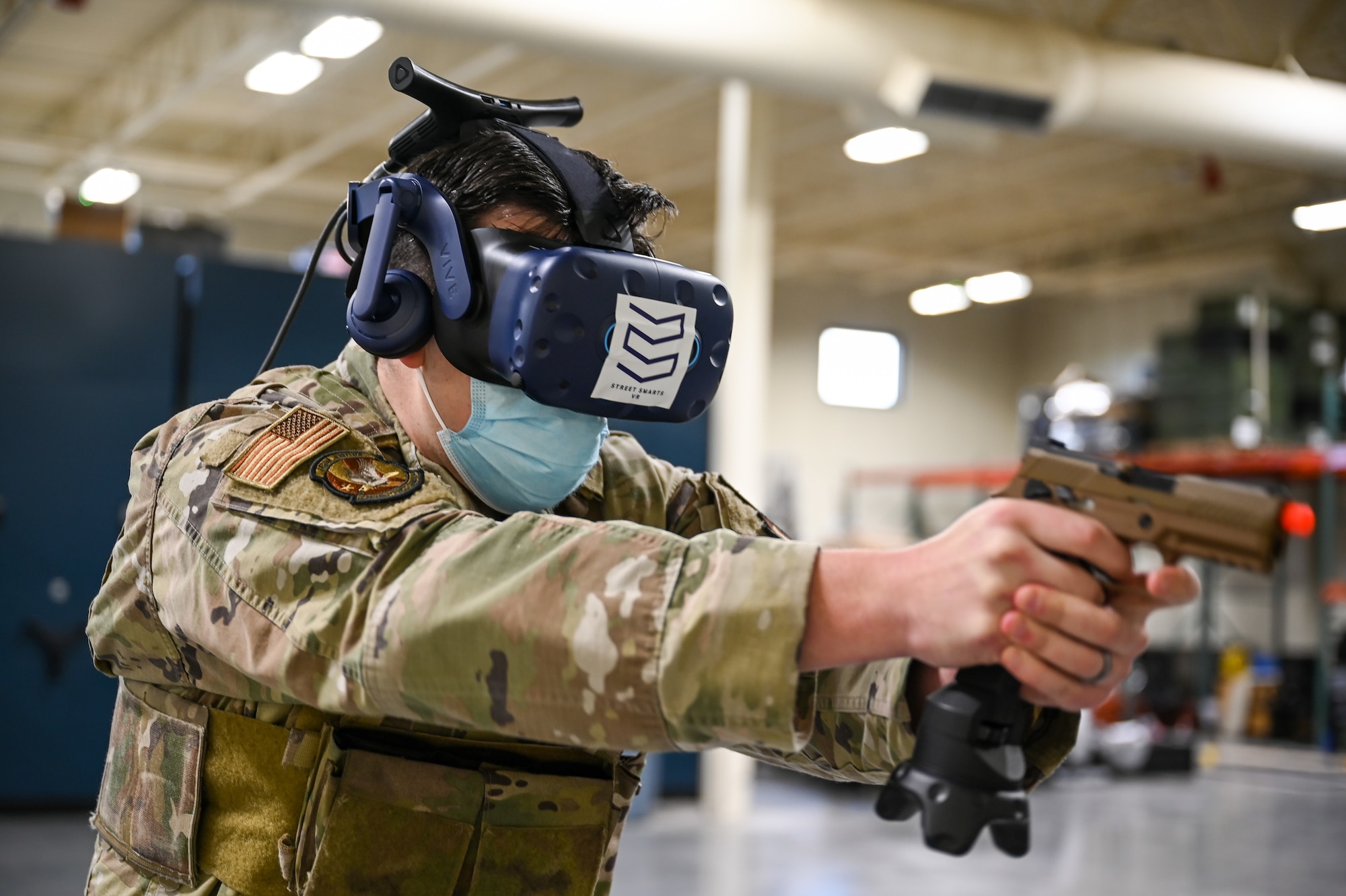 Staff Sgt. Brandon Wilson, 75th Security Forces Squadron, during a use-of-force response scenario with the Street Smarts Virtual Reality system. The squadron recently implemented virtual reality to fully immerse themselves into realistic three-dimensional situations to enhance their training. (U.S. Air Force photo by Cynthia Griggs)
