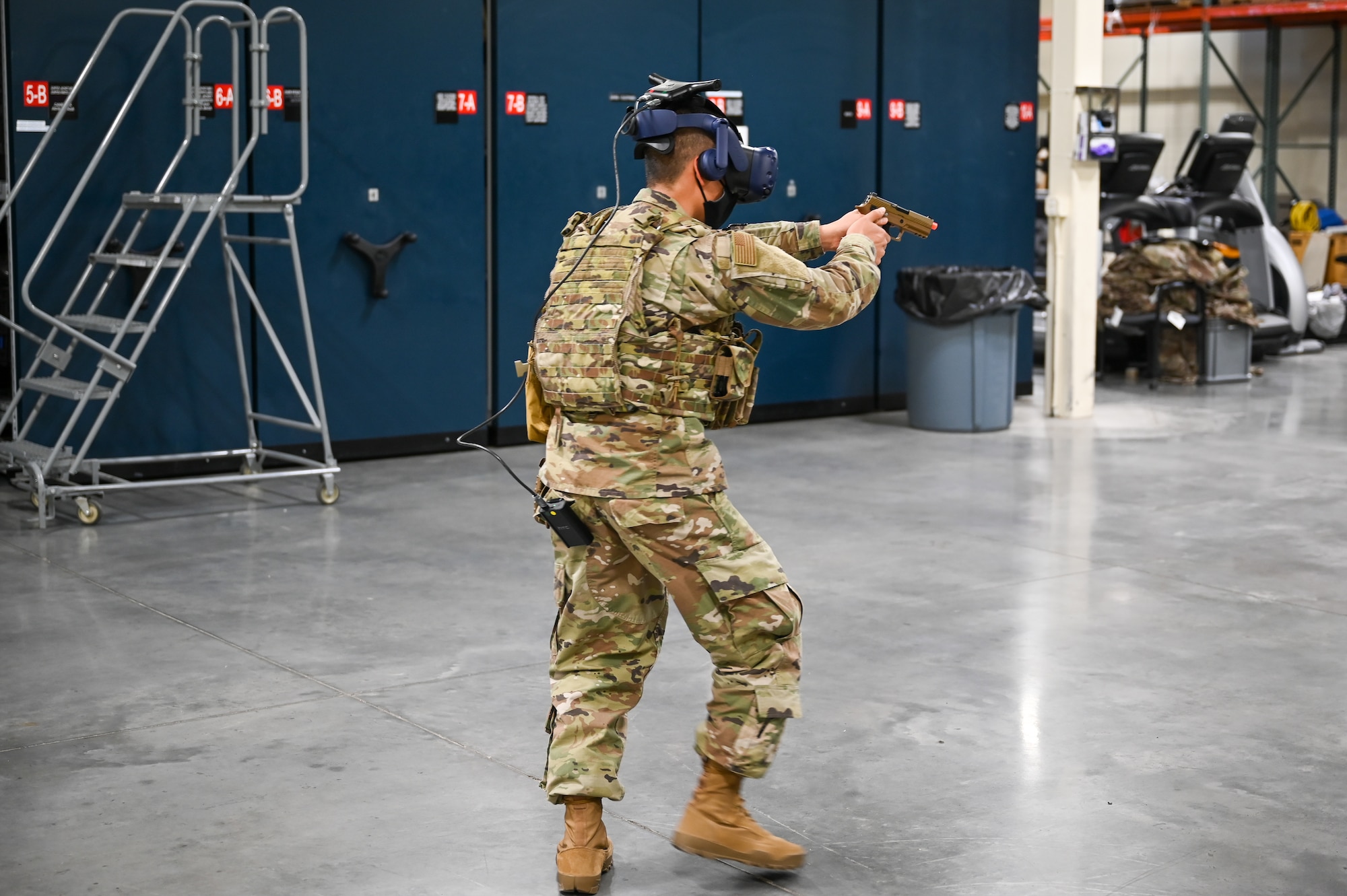 Airman 1st Class Alex Muralles, 75th Security Forces Squadron, during a use-of-force response scenario with the Street Smarts Virtual Reality system. The squadron recently implemented virtual reality to fully immerse themselves into realistic three-dimensional situations to enhance their training. (U.S. Air Force photo by Cynthia Griggs)