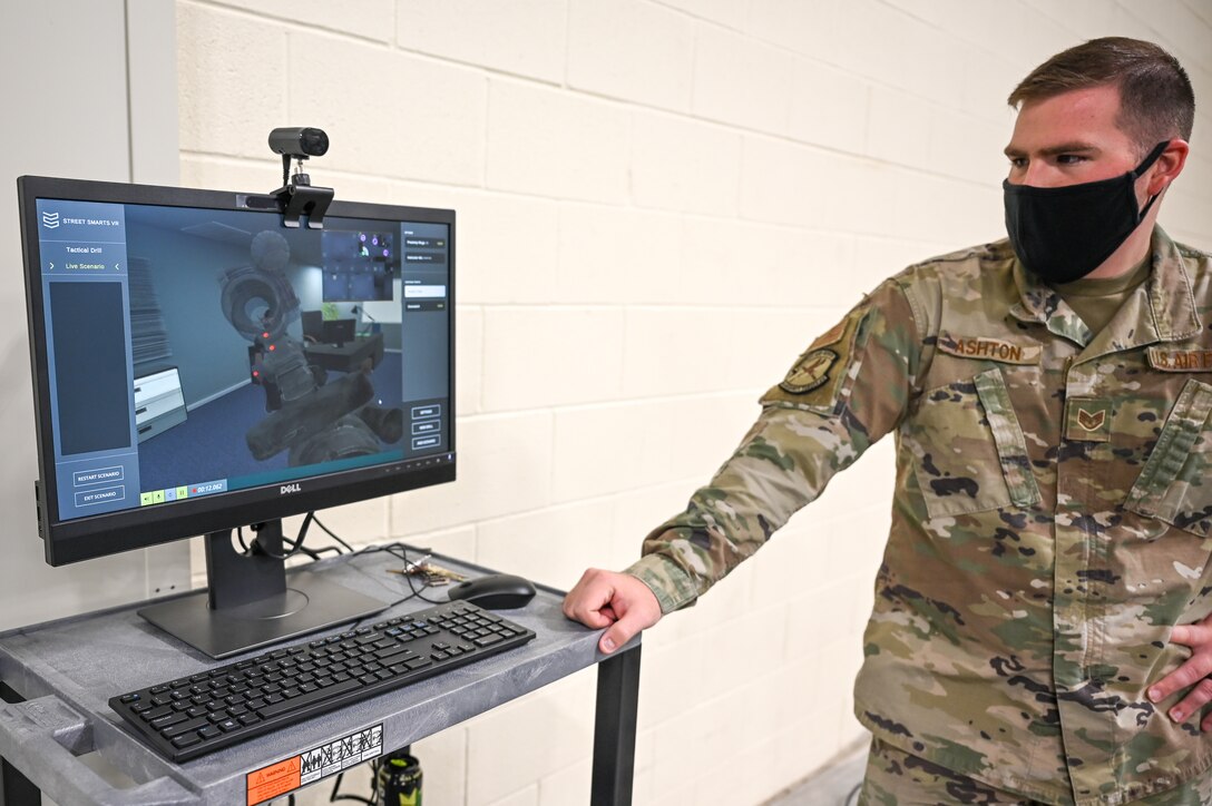 Staff Sgt. Devon Ashton, 75th Security Forces Squadron, shows a Defender's point of view when using the Street Smarts Virtual Reality system. The squadron recently implemented virtual reality to fully immerse themselves into realistic three-dimensional situations to enhance their training. (U.S. Air Force photo by Cynthia Griggs)