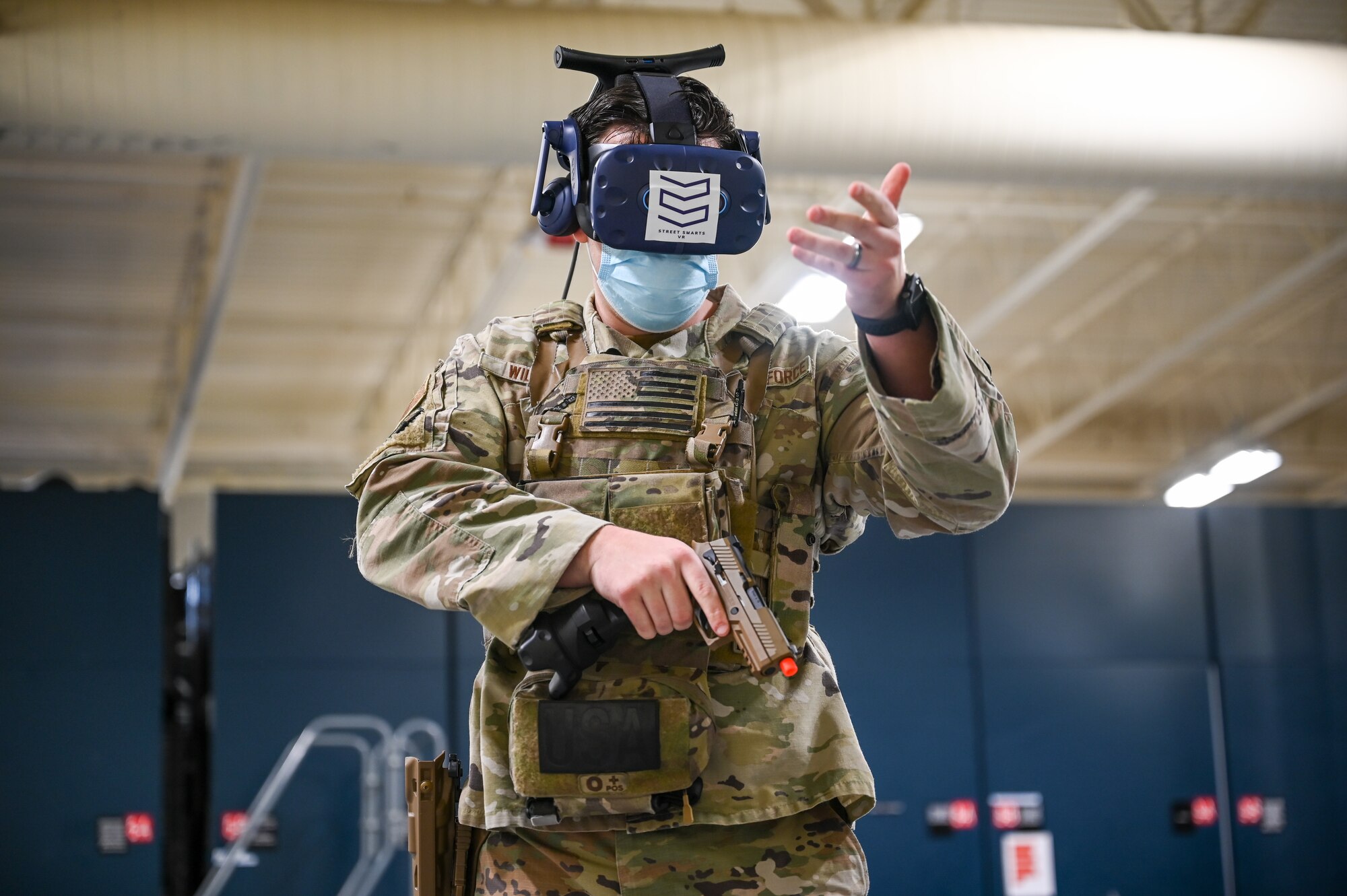 Staff Sgt. Brandon Wilson, 75th Security Forces Squadron, during a de-escalating an armed person scenario using the Street Smarts Virtual Reality system, The squadron recently implemented virtual reality to fully immerse themselves into realistic three-dimensional situations to enhance their training. (U.S. Air Force photo by Cynthia Griggs)
