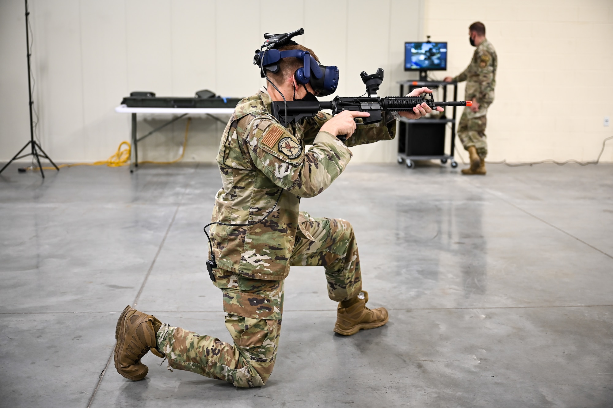 Tech. Sgt. Andrew Schnacker, 75th Security Forces Squadron, during a use-of-force response scenario with the Street Smarts Virtual Reality system. The squadron recently implemented virtual reality to fully immerse themselves into realistic three-dimensional situations to enhance their training. (U.S. Air Force photo by Cynthia Griggs)