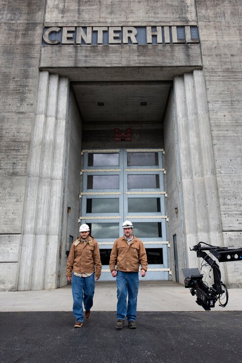 Senior Electrician Ron Gatlin (Right) and Electrician Kyle Mosakowski are captured on video Nov. 2, 2021 departing the Center Hill Dam Hydropower Plant in Lancaster, Tennessee, for a U.S. Army Corps of Engineers National Inventory of Dams video production. The Nashville District operates and maintains the project on the Caney Fork River in Lancaster, Tennessee. (USACE Photo by Lee Roberts)