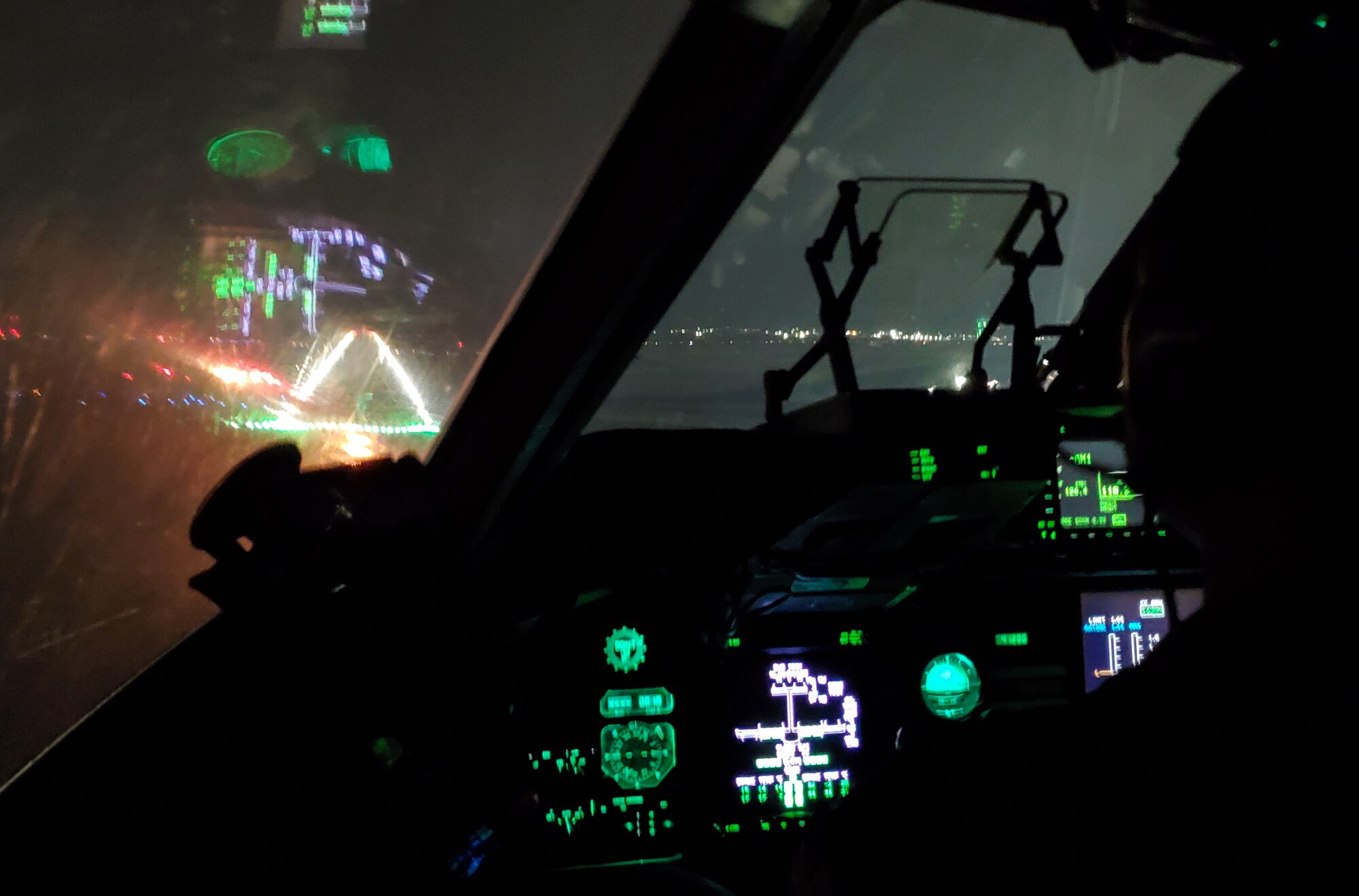 U.S. Air Force Capt. James Callen, 62nd Operations Support Squadron pilot, flies a C-17 Globemaster III towards a runway to execute an assault landing zone maneuver during Exercise Rainier War 21B at Moses Lake Municipal Airport, Washington, Nov. 3, 2021. The exercise is designed to demonstrate the wing’s ability to operate and survive while defeating challenges to the U.S. military advantage in all operating  domains – air, land, sea and cyberspace. (U.S. Air Force photo by Staff Sgt. Tryphena Mayhugh)
