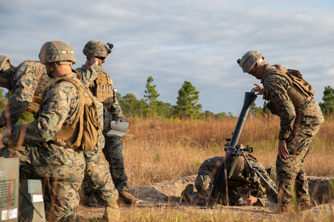U.S. Marines with 1st Battalion, 6th Marine Regiment, 2d Marine Division, prepare to shoot an 81mm mortar during a battalion field exercise (FEX) at Camp Lejeune, N.C., Nov. 3, 2021. A battalion FEX is designed to increase Marines strength, endurance, and mission readiness. (U.S. Marine Corps photo by Lance Cpl. Michael Virtue)