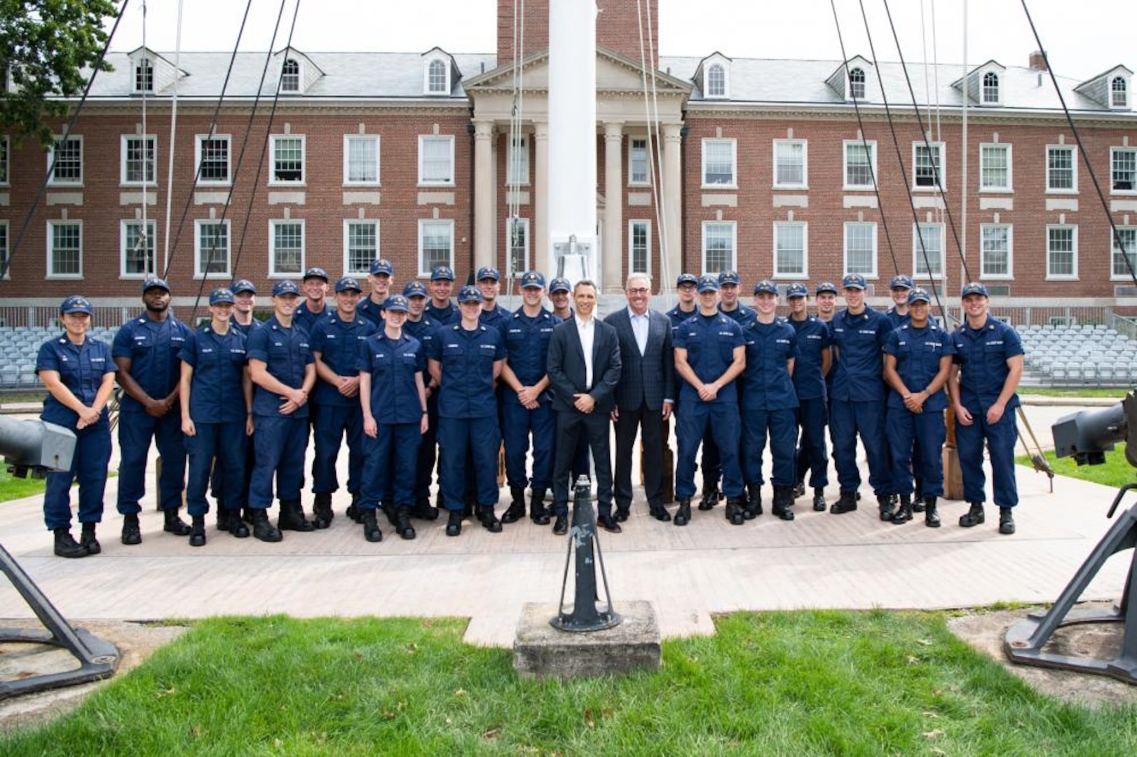 James Pitaro (center left), President of ESPN and Sal Paolantonio (center right), ESPN reporter, pose for a group photo with cadets from the U.S. Coast Guard Academy, here, Sep. 28, 2021. ESPN was filming with the Coast Guard for their annual Veterans Day special, this year's special is focused on the Coast Guard. (U.S. Coast Guard photo by Petty Officer 3rd Class Matthew Abban)